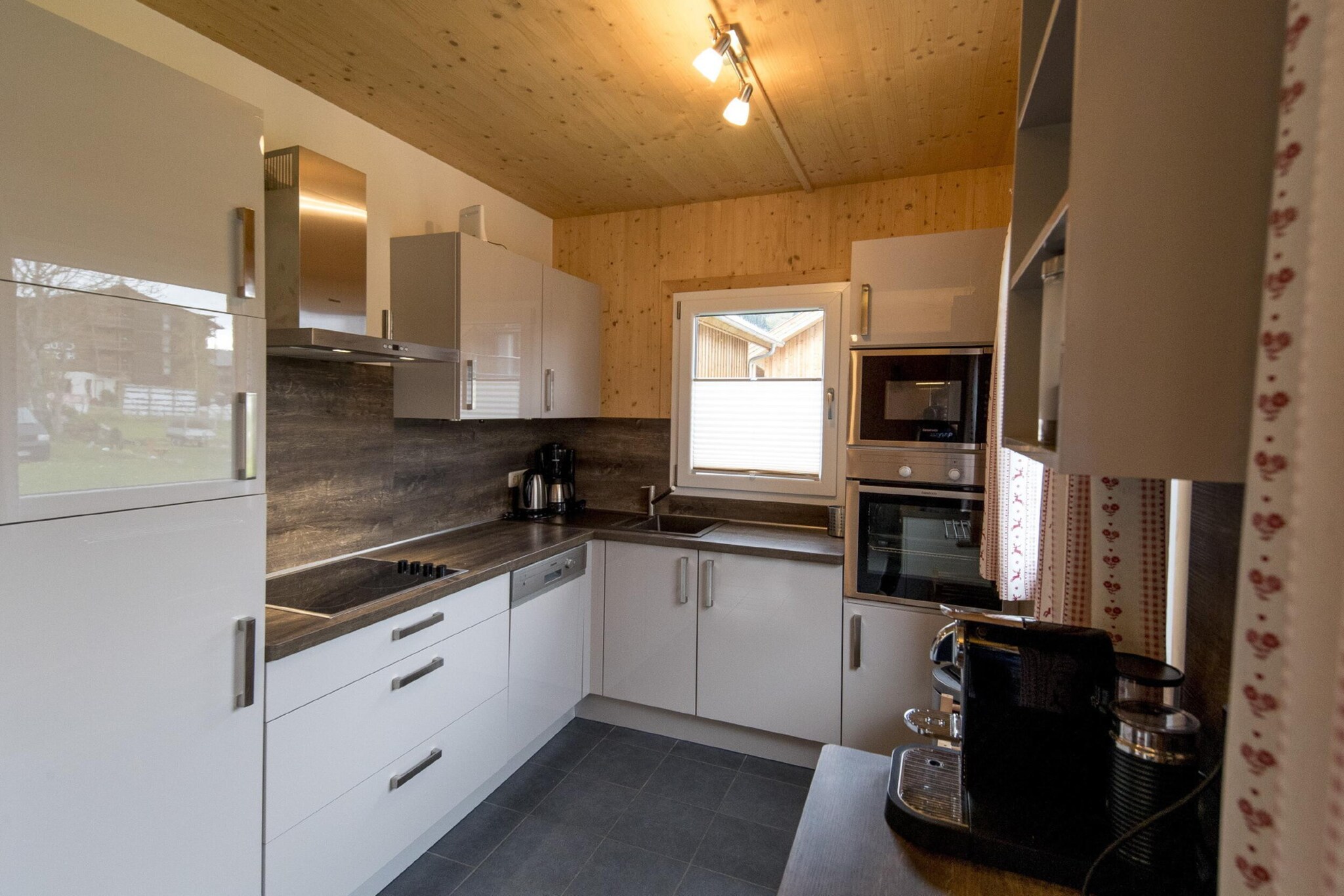 Ground floor: (hallway(washing machine, ski boot heaters), Living room(TV(satellite), DVD player, radio, CD player, gas fireplace), open kitchen(electric kettle, toaster, cooker(ceramic), coffee machine(espresso, filter), espresso machine, oven, grill, microwave, dishwasher, fridge-freezer, dishes and cutlery(Bowls, chopsticks, plates, cups, etc.)), bedroom(double bed), bathroom(shower, washbasin, toilet, hairdryer), Internet access)\n\nOn the 1st floor: (bedroom(double bed), bedroom(double bed), bedroom(double bed), bedroom(double bed), bathroom(shower, infrared sauna, washbasin, toilet))\n\ncot, hot tub, heating(electric, central), garden, parking, children\'s bed, high chair, drying cabinet