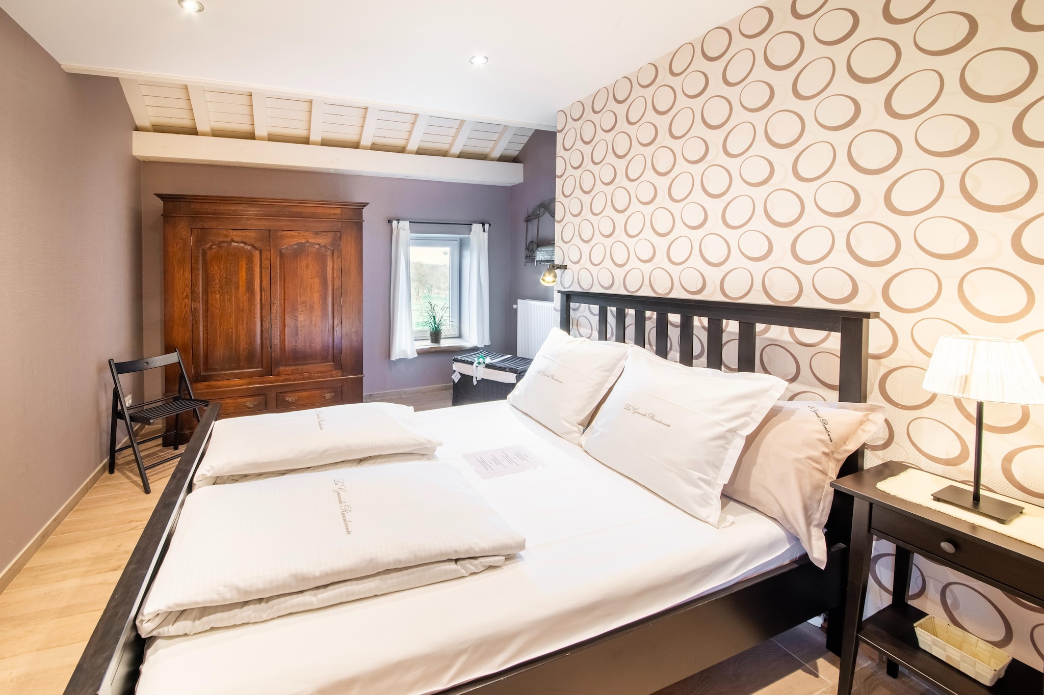 Ground floor: (Living room(TV, stereo unit), Kitchen(stove(wood), cooker, oven, microwave), bedroom(single bed, double bed, children\'s bed), bathroom(bath tub, shower, washbasin, toilet), recreation room(table football, air hockey), pantry(freezer, fridge-freezer, tumble dryer), storage)\n\nOn the 1st floor: (open kitchen(cooker(5 ring stoves), oven, microwave, dishwasher, fridge, freezer), Living/diningroom, bedroom(double bed), bedroom(single bed, double bed), bedroom(double bed), bathroom(shower, washbasin, toilet), toilet, Landing)\n\nOn the 2nd floor: (bedroom(single bed), bedroom(double bed), bedroom(double bed), bedroom(double bed), bedroom(single bed, double bed), bathroom(bath tub, shower, washbasin, toilet))\n\nrelaxation area(reachable from the outside)(infrared sauna), garage, stables, heating(central), courtyard, terrace(roofed), garden, garden furniture, BBQ, parking, play equipment