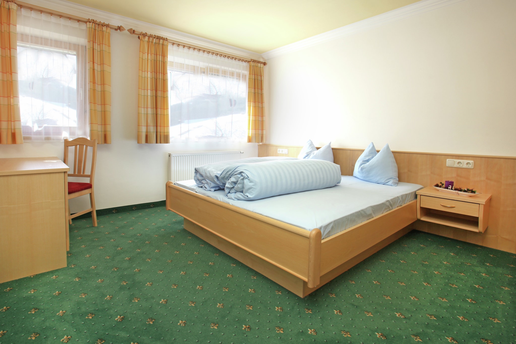 Basement: (Living room(TV, balcony or terrace), open kitchen(cooker(4 ring stoves), oven, dishwasher, fridge-freezer), bedroom(double bed), bedroom(bunk bed), bathroom(shower, 2x washbasin), toilet)\n\nrecreation room(table tennis table, table football), ski storage(ski boot heaters), parking