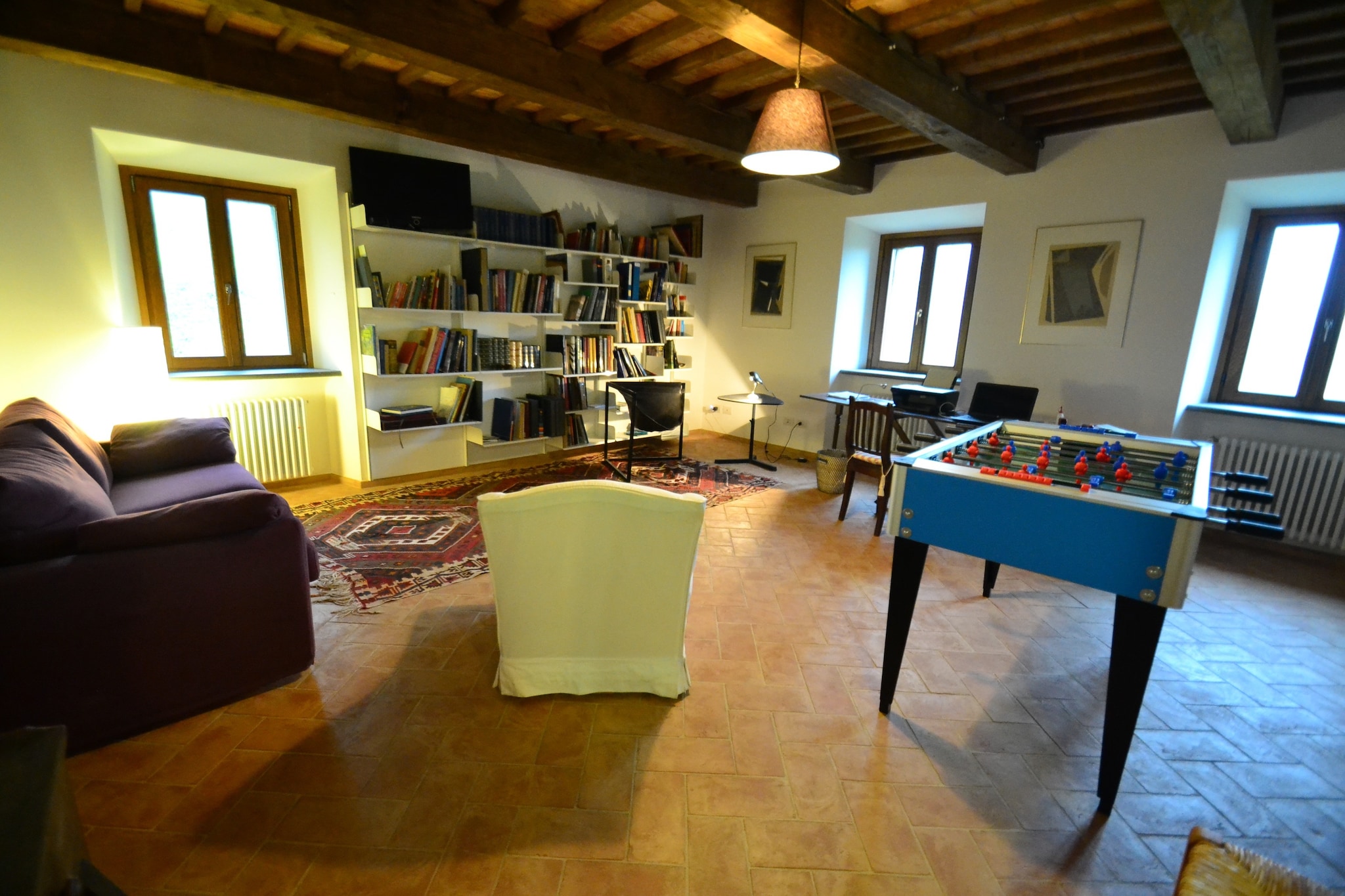 Ground floor: (Living room(TV(satellite), fireplace, seating area), dining room(dining table(12 persons)), Kitchen(cooker(4 ring stoves), oven, dishwasher, fridge-freezer), toilet(toilet), pantry(tumble dryer, washbasin, washing machine), video projector)\n\nOn the 1st floor: (bedroom(double bed or 2 single beds, heating), bedroom(double bed or 2 single beds, heating), bathroom(shower, washbasin, toilet, bidet, heating))\n\nOn the 2nd floor: (bedroom(double bed or 2 single beds, heating), bedroom(double bed or 2 single beds, heating), bedroom(double bed or 2 single beds, heating), bedroom(double bed or 2 single beds, heating), bathroom(shower, washbasin, toilet), bathroom(shower, washbasin, toilet), bathroom(shower, washbasin, toilet))\n\nfitness room(reachable from the outside, 50 m2)(washbasin, toilet), wood cooker, hip bath, shower(outside), patio, terrace, garden(fenced, 1,5 hm2), garden furniture, BBQ(charcoal), table football