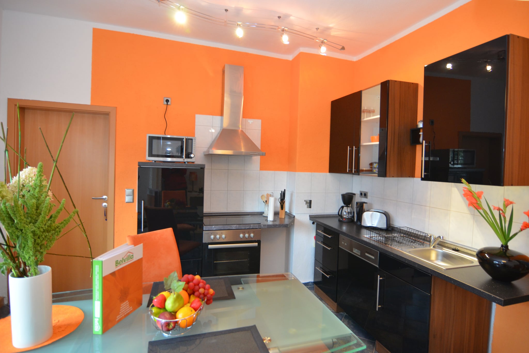 On the 1st floor: (Kitchen(dining table, electric kettle, toaster, cooker(4 ring stoves, ceramic, electric), coffee machine(filter), oven, microwave, dishwasher, fridge-freezer), Living/bed room(double bed, TV(cable), seating area, radio), bathroom(bath tub, shower, washbasin, toilet, hairdryer))\n\nSitting room, heating(central, oil), parking