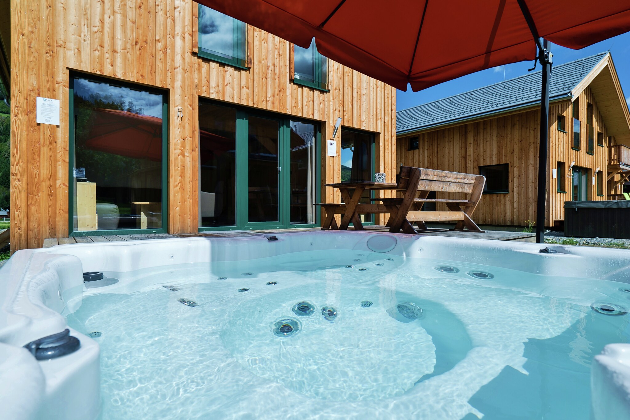 "Discover unparalleled comfort and luxury in our exclusive chalet, offering 100 m² of beautifully designed living space that accommodates up to 9 guests. Perfectly situated at the Kreischberg Valley Station, this chalet combines modern amenities with an ideal location for an unforgettable mountain retreat. The chalet features four spacious bedrooms designed for a restful stay. Two bedrooms each have double beds, while a third bedroom offers two single beds, and a fourth bedroom is equipped with three single beds, ensuring ample and flexible sleeping arrangements. The two bathrooms are well-appointed with either a shower or an indoor whirlpool tub, with a hairdryer available for your convenience.
Located directly at the Kreischberg Valley Station, the chalet offers immediate access to premier skiing, charming local shops, and breathtaking alpine scenery.
The heart of the chalet is its expansive living-dining area, which boasts a cozy seating arrangement and a flat-screen TV, perfect for relaxation and entertainment after a day on the slopes. The open-plan kitchen is fully equipped to meet all your culinary needs, featuring cutlery, cookware, a ceramic hob, oven, dishwasher, and a fridge with a freezer compartment. Additional conveniences include a toaster, kettle, and coffee machine. A small starter kit with essential cleaning supplies and dishwashing items will be available upon your arrival to ensure a smooth start to your stay. Enjoy the luxury of your own private whirlpool, ideal for unwinding and rejuvenating. Complimentary Wi-Fi and satellite TV are provided to keep you connected and entertained throughout your visit.
As a special benefit, your stay includes the Murau-Murtal GuestCard for summer activities, which provides additional perks and discounts on local attractions. "