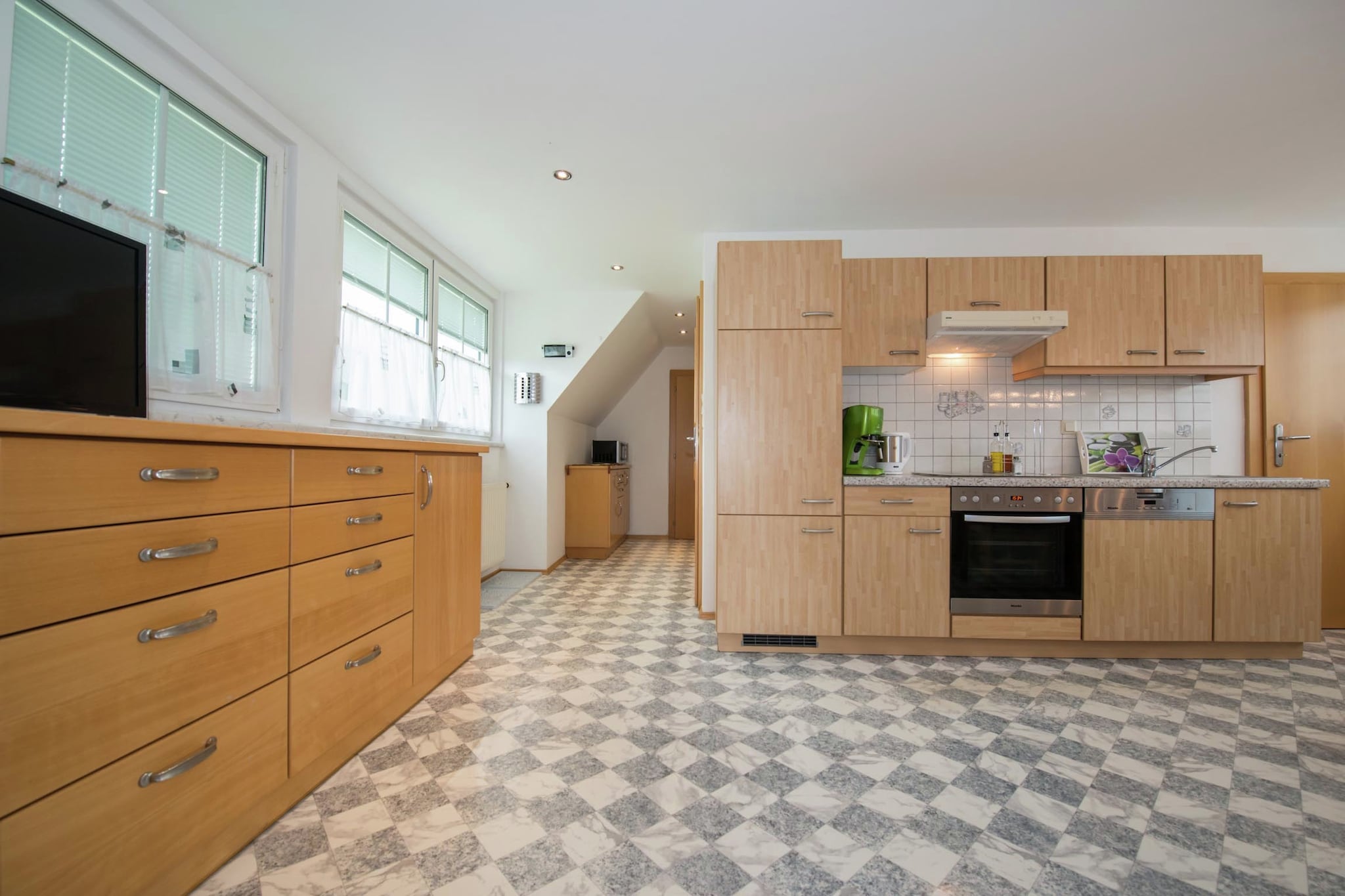 On the 1st floor: (Large kitchen(TV, cooker(4 ring stoves, ceramic), oven, microwave, dishwasher, fridge), bedroom(single sofa bed, double bed, TV), bedroom(double bed), bathroom(shower, washbasin, toilet))\n\nbalcony, garden, garden furniture, parking