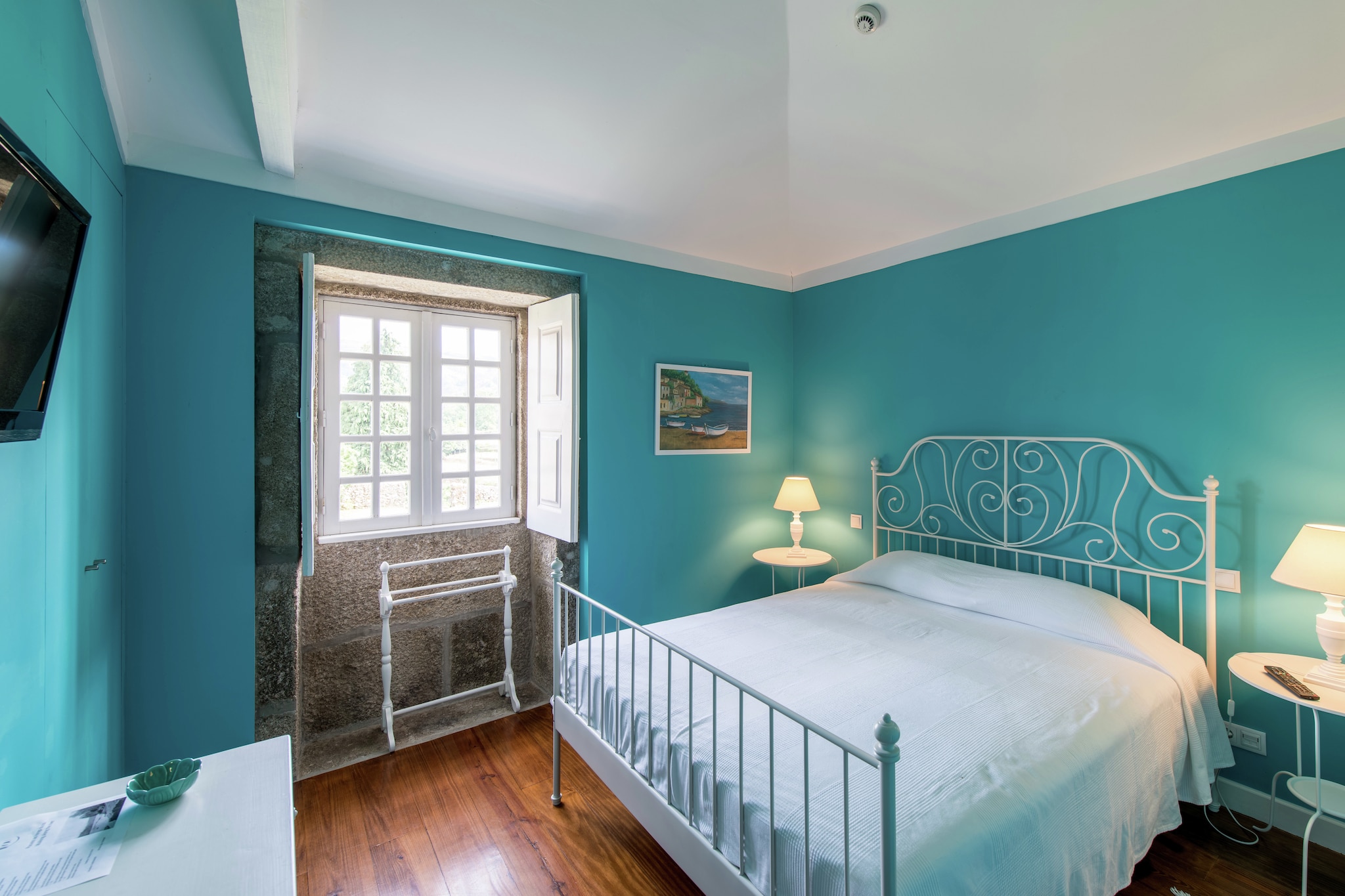 This renovated holiday home is located in Ponte de Lima and features 3 bedrooms to accommodate 6 people, making it well-suited for a large family or group. There is a shared swimming pool for refreshing dips and a private terrace to relax.
The town center of Ponte de Lima is 5 km away, where you can go shopping or enjoy meals at the restaurants. There is a river, just 500 m away, if you want to go for picnics. A day trip to the sea, located a short drive away can also be planned.
The home has a shared furnished garden so that you can enjoy the barbecued meals in the evenings. The indoor heating facility is chargeable and keeps you cozy. The fireplace in the living cum dining room keeps the indoor warm and cozy. You can sunbathe on the loungers and get tanned. A well-equipped kitchen is there so that you can cook as you wish. Parking is available.
The airport is 90 km away from the home.
A utilities & service fee of EUR 100,00 will be required closer to your checkin date. You will receive a separate communication with the payment link. The utilities & service fee ensures a smooth stay and covers any additional services such as cleaning, service charges, consumption, damages or any additional charges incurred during the stay.