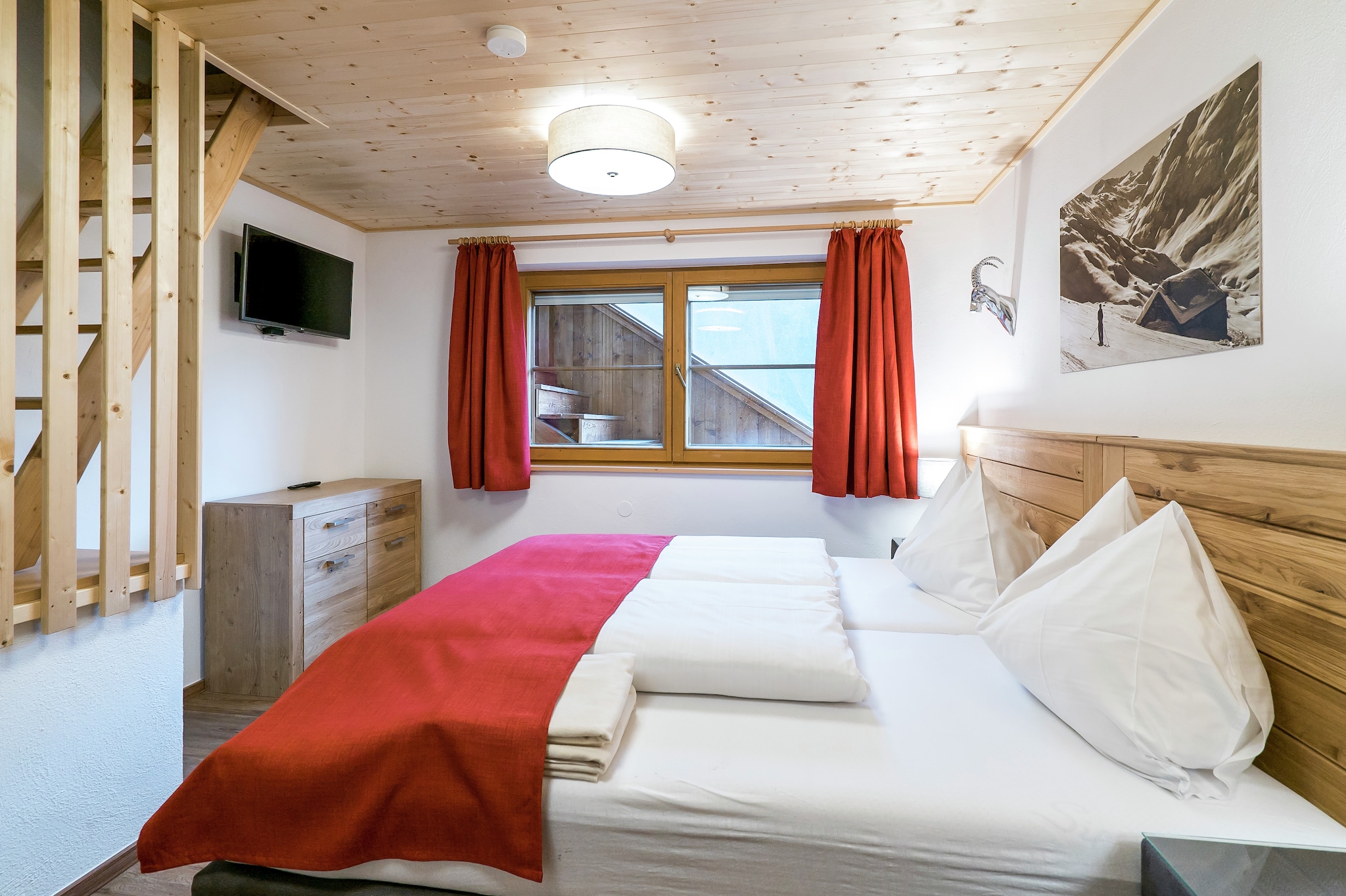 Ground floor: (Living room(double sofa bed, TV, balcony), Kitchen(cooker, oven, microwave, fridge), bedroom(2x single bed, TV, balcony), bedroom(2x single bed, bunk bed, TV), bathroom(shower, 2x washbasin, toilet), bathroom(shower, washbasin), toilet)\n\nmezzanine: (Bedroom with bathroom(shared entrance)(4x single bed, shower, washbasin, toilet))\n\nBasement: (tumble dryer(shared with other guests), washing machine(shared with other guests))\n\nski storage(shared with other guests)(ski boot heaters), BBQ(shared with other guests), parking, children\'s bed, high chair