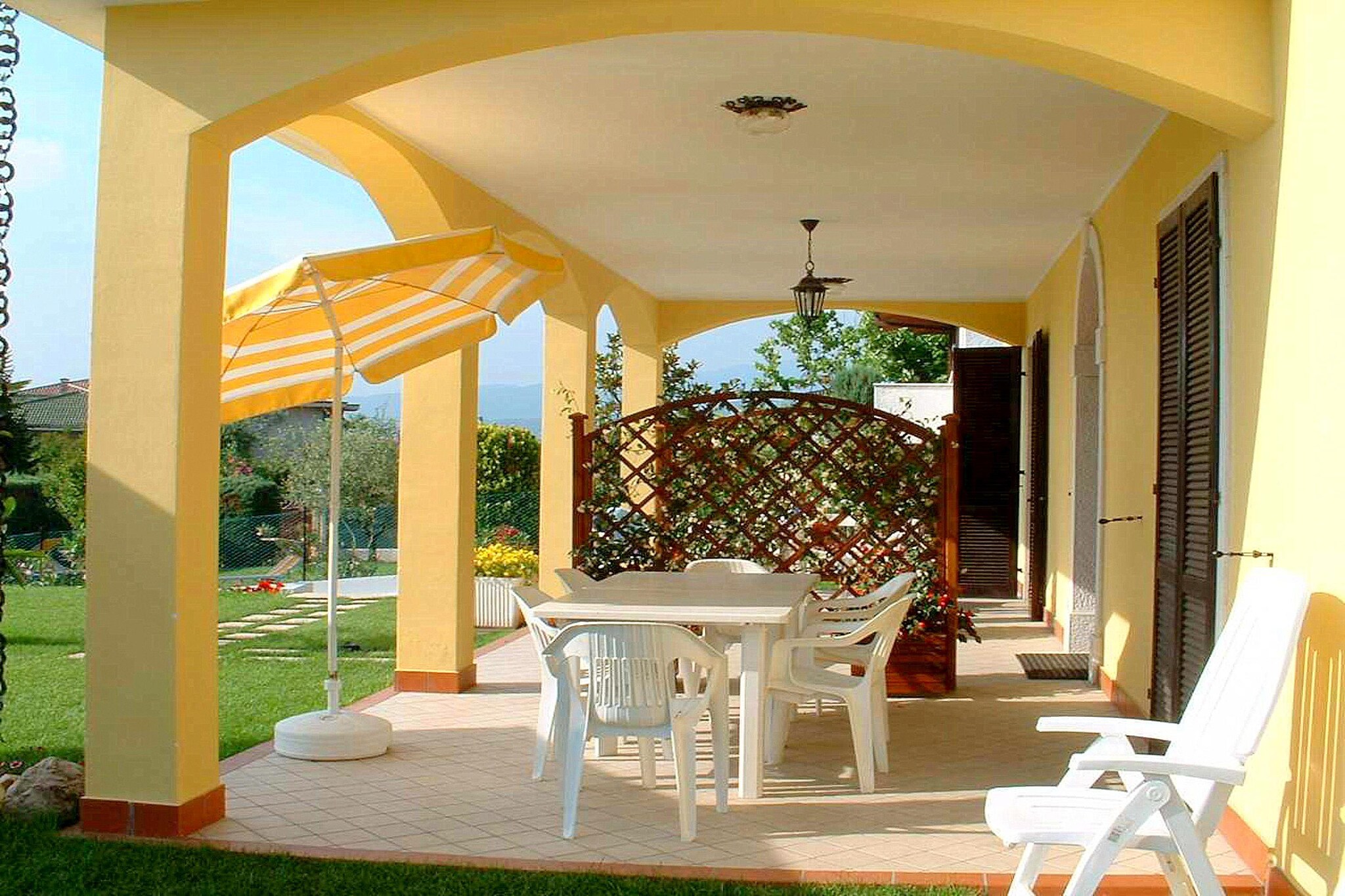 Located close to a lake, this comfortable holiday home in Lazise has a shared swimming pool for refreshing in hot summer days. The 2-bedroom property is good enough for a family of 4 or a small group of friends.



Gardaland (the biggest Italian amusement park) is less than 10 min. drive from the home. The town of Lazise is 2 km away if you want to enjoy city life and avail facilities. Restaurants are just 300 m away if itÂ’s a no-cook day for you. There is a lake, 900 m away, if you want to enjoy water sports. The nearest stores are also 900 m away.



The living room has a double sofa bed, where you can relax after a tiring day. The open kitchen is equipped for your cooking needs. The centrally heated home has a shared garden, where you can relax on a good day while kids play around. On the shared terrace, you can gather and enjoy sizzling barbecue meals. There is a balcony to cherish the lovely surroundings. Parking is on-site.



Public transport is available 400 m away.