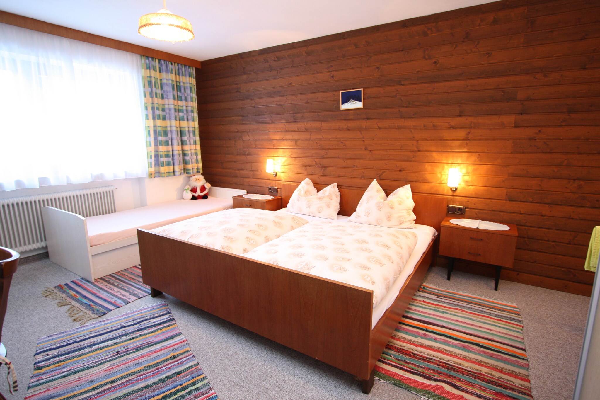 Ground floor: (Large kitchen(wood cooker, cooker(4 ring stoves), oven, fridge-freezer), bedroom(2x single bed, washbasin), bedroom(double bed), bedroom(single bed, double bed, shower, washbasin), bathroom(shower, washbasin, toilet), toilet, storage)\n\nheating, garden furniture, parking, children\'s bed