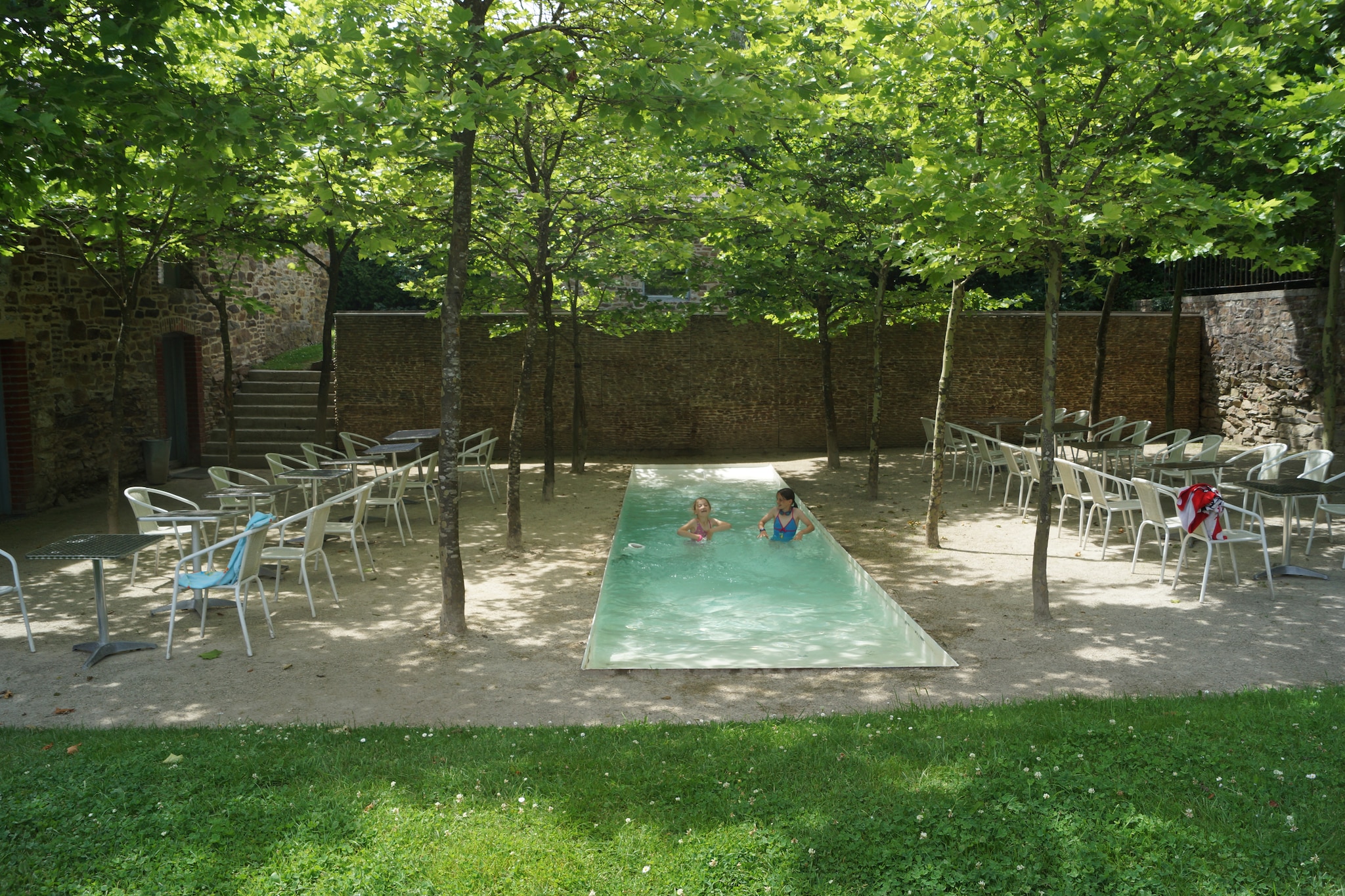 Ground floor: (open kitchen(dining table(34 persons), cooker(1 ring stove, ceramic), 2x coffee machine(pads), oven(grill-oven), 3x combination microwave, 2x dishwasher, 5x fridge, 2x freezer, 4x high chair), Living/diningroom(TV(flatscreen), dining table(34 persons), fireplace, radio, CD player, stereo unit))\n\nbedroom(double bed or 2 single beds), bedroom(3x single bed), bedroom(3x single bed), bedroom(4x single bed), bedroom(double bed), bedroom(double bed), bedroom(double bed), bedroom(double bed), bedroom(single bed, double bed), bedroom(single bed, double bed), bedroom(2x single bed, double bed), bedroom(2x single bed, double bed), bathroom(toilet), bathroom(toilet), bathroom(toilet), bathroom(toilet), bathroom(toilet), bathroom, bathroom, bathroom, bathroom, bathroom, bathroom, toilet, toilet, toilet, mezzanine, single folding bed, single folding bed, fireplace, terrace(300 m2), terrace(200 m2), garden, garden furniture, BBQ, pond, boules court, play equipment, children\'s bed, children\'s bed