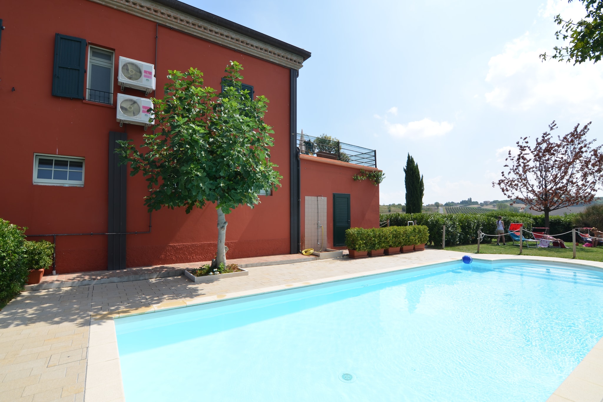Set amidst the hills of Passano di Coriano, this charming first-floor apartment offers a serene retreat in the heart of the Emilia-Romagna countryside. The apartment is part of an authentic agriturismo, surrounded by lush vineyards and scenic landscapes. Guests can unwind in the shared garden, soak up the sun on the communal roof terrace, or take a refreshing dip in the shared swimming pool. The tranquil setting, along with the comfort of air conditioning, creates an ideal space for rest and relaxationâ€”perfect for couples, small families, or solo travelers looking to disconnect from daily life.

While peaceful and private, the location offers great proximity to top local attractions. Just 9 km away, Riccione invites you to its golden beaches and lively Adriatic coast. Families will love visiting Aquafan and Oltremare, both only 8 km away. Wine lovers can enjoy tastings right on-site, as the agriturismo produces its own local wine. For a cultural touch, the unique La Storia del Sic museum is just 190 meters away, while nature enthusiasts can visit the nearby Biological Valley delle Lepri park.

Food lovers are in for a treat with numerous excellent dining options just a short drive away in Coriano. Try Locanda i Girasoli for refined regional cuisine or Trattoria il Mulino for hearty local dishes in a rustic setting. For something more casual, Pizzeria Grazie Marco is perfect for a relaxed evening. Donâ€™t miss the chance to pair your meal with local wines produced right on the estateâ€”an authentic taste of the region, enjoyed just steps from your accommodation.