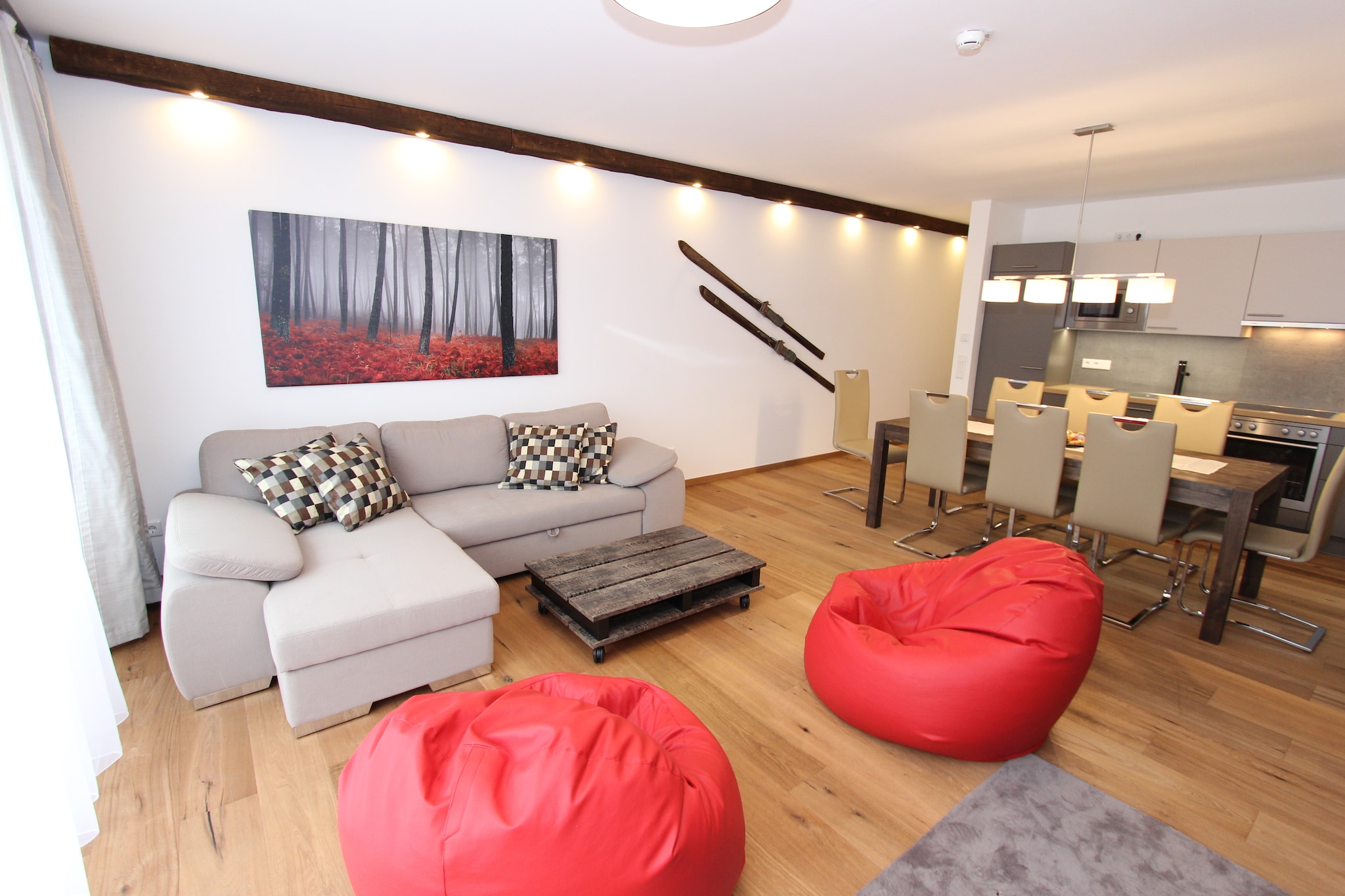 On the 1st floor: (Living room(double sofa bed), open kitchen(cooker(ceramic), oven, dishwasher, fridge-freezer), bedroom(double bed), bedroom(double bed, TV), Bedroom with bathroom(double bed, shower, washbasin, toilet), bathroom(shower, washbasin, toilet))\n\nsanitary facility(tumble dryer(shared with other guests), washing machine(shared with other guests)), relaxation area(shared with other guests)(shower, massage shower, sauna, toilet), garage, ski boot heaters, balcony or terrace, heating(Floor heating), lift, safety deposit box