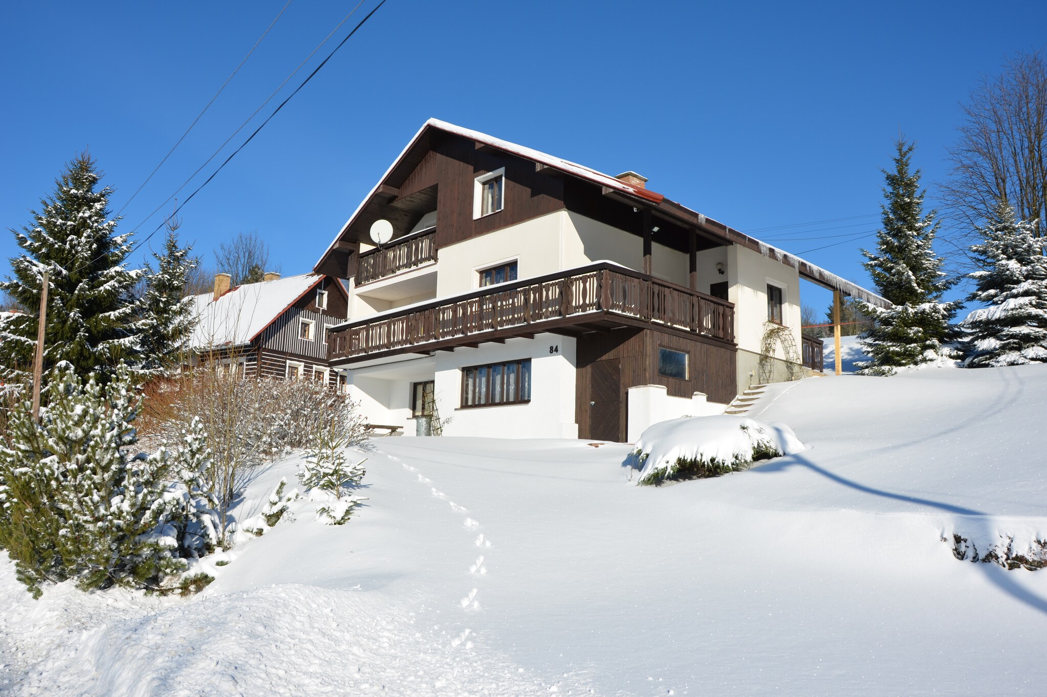 The surrounding mountains of Krkonose National Park make this pet-friendly holiday home in JestrabÃ­ v KrkonoÂšÃ­ch a fantastic stay. Close to the ski lift and forest, it is a great choice for a group of 9 or small families. It has a balcony to linger with a cool drink and electric heating for comfort.



There are many opportunities for skiing and the ski lift at 1 km takes you to the slopes of the Giant Mountains. The ski regions of Rokytnice nad Jizerouare also nearby. Enjoy long walks to Jilemnice, Dvoracky, or to Krkonose. You can try horse riding and golf in the vicinity, and there is a swimming pool at 4 km. The Jilemnice town center is at 10 km, while restaurants and supermarket are at 200 m and 800 m respectively.



You can enjoy the surroundings from the balcony or the private furnished garden. There is a living room with TV, free WiFi, 2 kitchens, and cozy bedrooms for your comfort. 2 pets can stay at Â€ 3/Pet/Night. Parking is available.



Train station lies 4 km away.