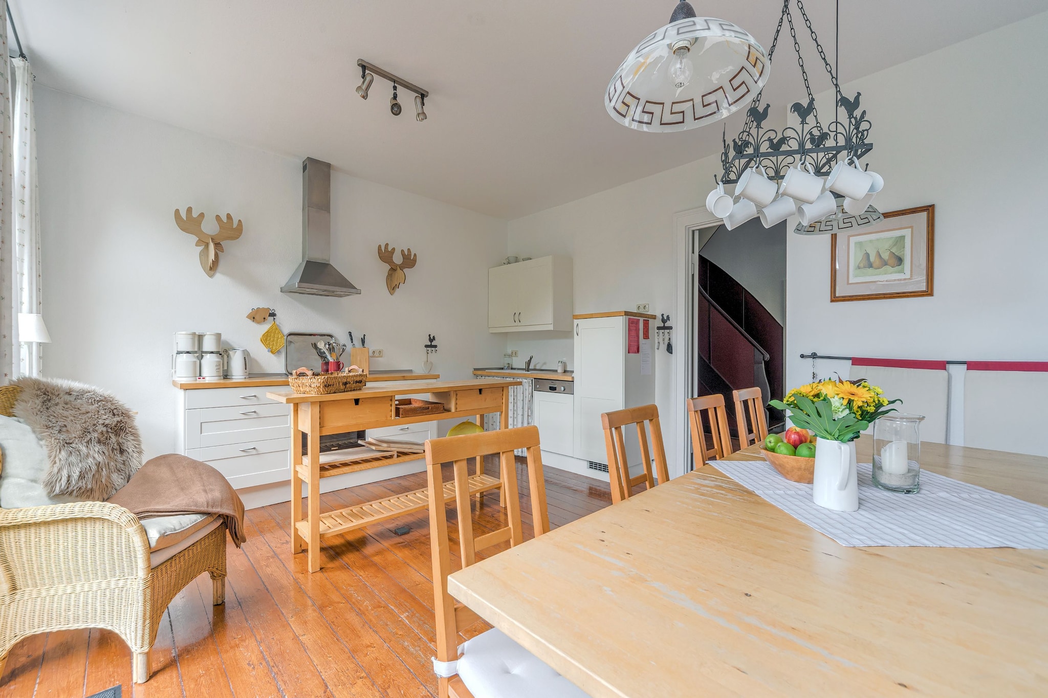 Ground floor: (Entrance, shared room(fireplace))\n\nOn the 1st floor: (Living room, open kitchen(cooker(4 ring stoves, electric), coffee machine(filter), oven, fridge-freezer), Large kitchen(radio, cooker(ceramic), oven, dishwasher, fridge-freezer), Living/diningroom(radio), bedroom(single bed, single bed, single bed), bathroom(bath tub, shower, washbasin), bathroom(bath tub, shower, washbasin), toilet, Landing, storage(washing machine))\n\nOn the 2nd floor: (bedroom(single bed, single bed, double sofa bed), bedroom(2x single bed), bedroom(2x single bed), bedroom(double bed), walk-through bedroom(2x single bed), bathroom(shower, washbasin, toilet), bathroom(shower, washbasin, toilet), Landing)\n\nrecreation room, stove, grill, microwave, bathtub or shower, sauna(paid), balcony, heating, terrace(private), garden, bicycle storage, garden furniture, sun loungers, parking, deckchairs, children\'s bed, high chair, party games, Towels/Sheets (extra fee)