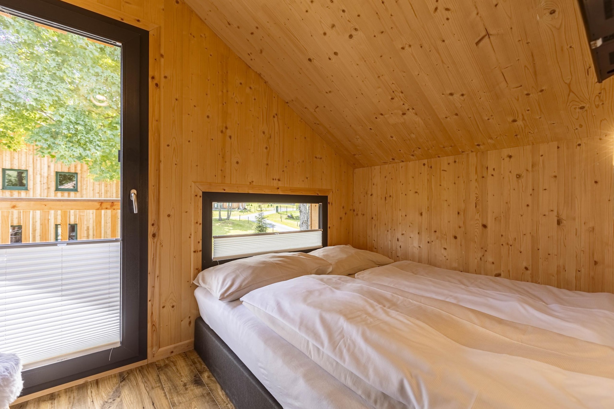 "Discover the ultimate retreat in this exclusive deluxe chalet, perfectly designed to accommodate up to 6 guests across 70mÂ² of beautifully appointed living space. Nestled in a top location at the Kreischberg valley station, this chalet offers easy access to outdoor adventures and winter sports. 

 Whether you're visiting in the summer or winter, this chalet provides a perfect base for your adventures. Enjoy the Murau-Murtal GuestCard, included with your stay, which offers additional benefits and discounts for local attractions. 

The chalet features three inviting bedrooms, each furnished with comfortable double beds, ensuring restful nights after a day of exploring. Two modern bathrooms with showers and toilets, complete with hairdryers, add to the convenience and comfort of your stay. Relax and unwind in the spacious living-dining area, where a cosy seating arrangement and flat-screen TV create a welcoming atmosphere for gathering with family or friends. The open kitchen is fully equipped for all your culinary needs, including cutlery, cookware, a ceramic hob, oven, dishwasher, and fridge with freezer compartment. Additional amenities such as a toaster, kettle, and coffee machine are also provided. A small starter set, including dishwasher tabs, dishwashing liquid (sample), sponge, garbage bags, cleaning supplies, and a tea towel, will be ready for you upon arrival. For your convenience, Wi-Fi and satellite TV are included, ensuring you stay connected and entertained throughout your stay."