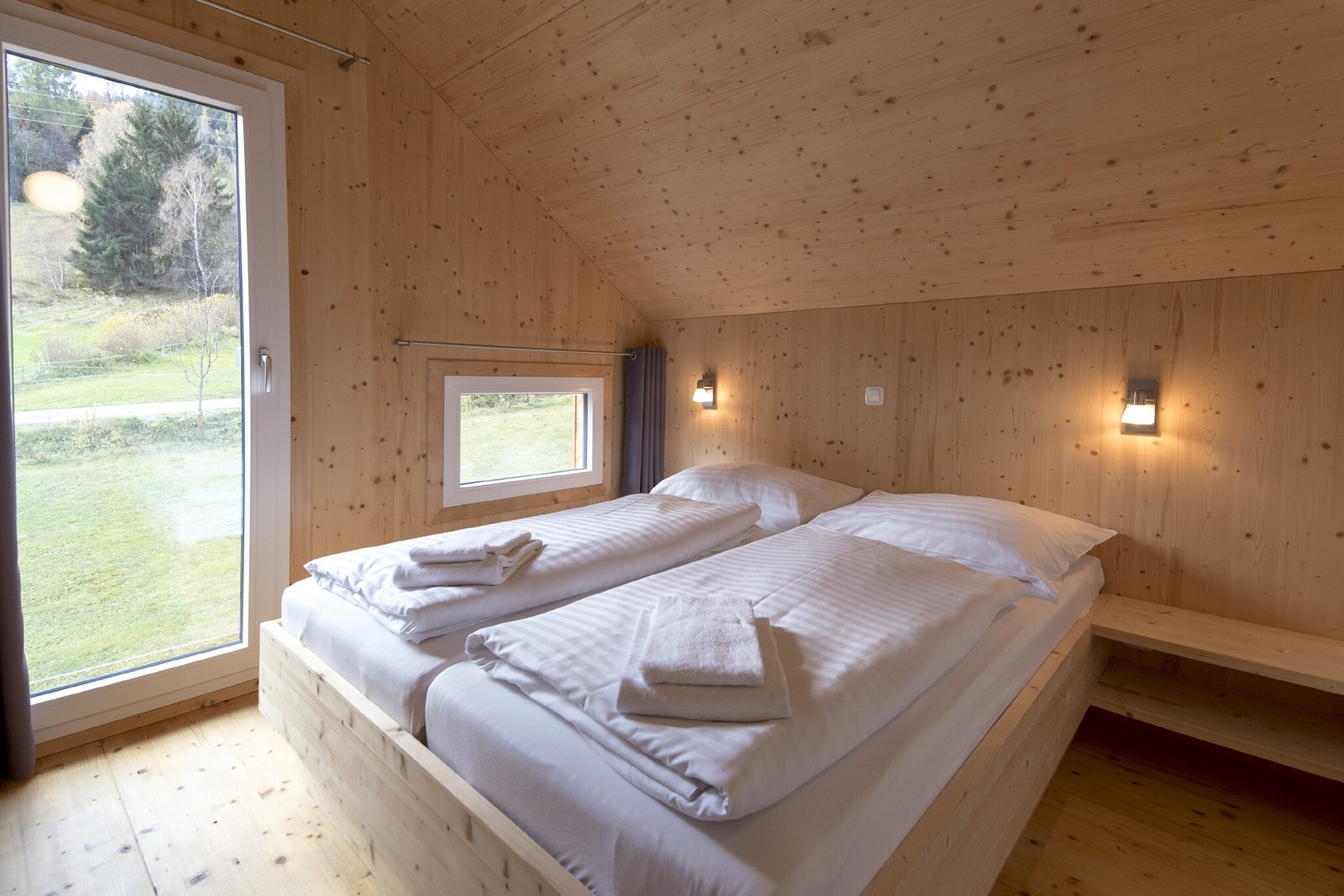 Ground floor: (hallway(ski boot heaters), Living room(gas fireplace), open kitchen(electric kettle, toaster, cooker(ceramic), coffee machine(espresso, filter), oven, microwave, dishwasher, fridge-freezer, dishes and cutlery(Bowls, chopsticks, plates, cups, etc.)), bathroom(shower, infrared sauna, washbasin, hairdryer), toilet, Internet access)\n\nOn the 1st floor: (bedroom(single bed, bunk bed, TV), bedroom(double bed), bedroom(double bed), bedroom(double bed), bathroom(Bubble bath, shower, washbasin, toilet))\n\nBubble bath, ski storage(ski boot heaters), hot tub, washing machine, heating(electric, central), terrace, garden, garden furniture, parking, drying cabinet