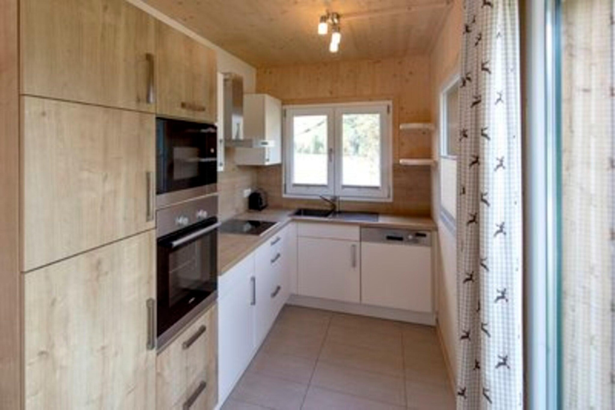 Ground floor: (open kitchen(hob(ceramic), electric kettle, toaster, coffee machine(filter), oven, microwave, dishwasher, fridge-freezer, dishes and cutlery), Living/diningroom(TV(satellite), dining table, DVD player, radio, CD player, gas fireplace), bedroom(single bed, single bed), bathroom(shower, washbasin, toilet), Internet access)\n\nOn the 1st floor: (bedroom(double bed), bedroom(double bed), bedroom(double bed), bedroom(double bed), bathroom(Bubble bath, shower, infrared sauna, washbasin, toilet, hairdryer))\n\ncot, washing machine, ski boot heaters, heating(electric, central), terrace, garden furniture, parking, high chair