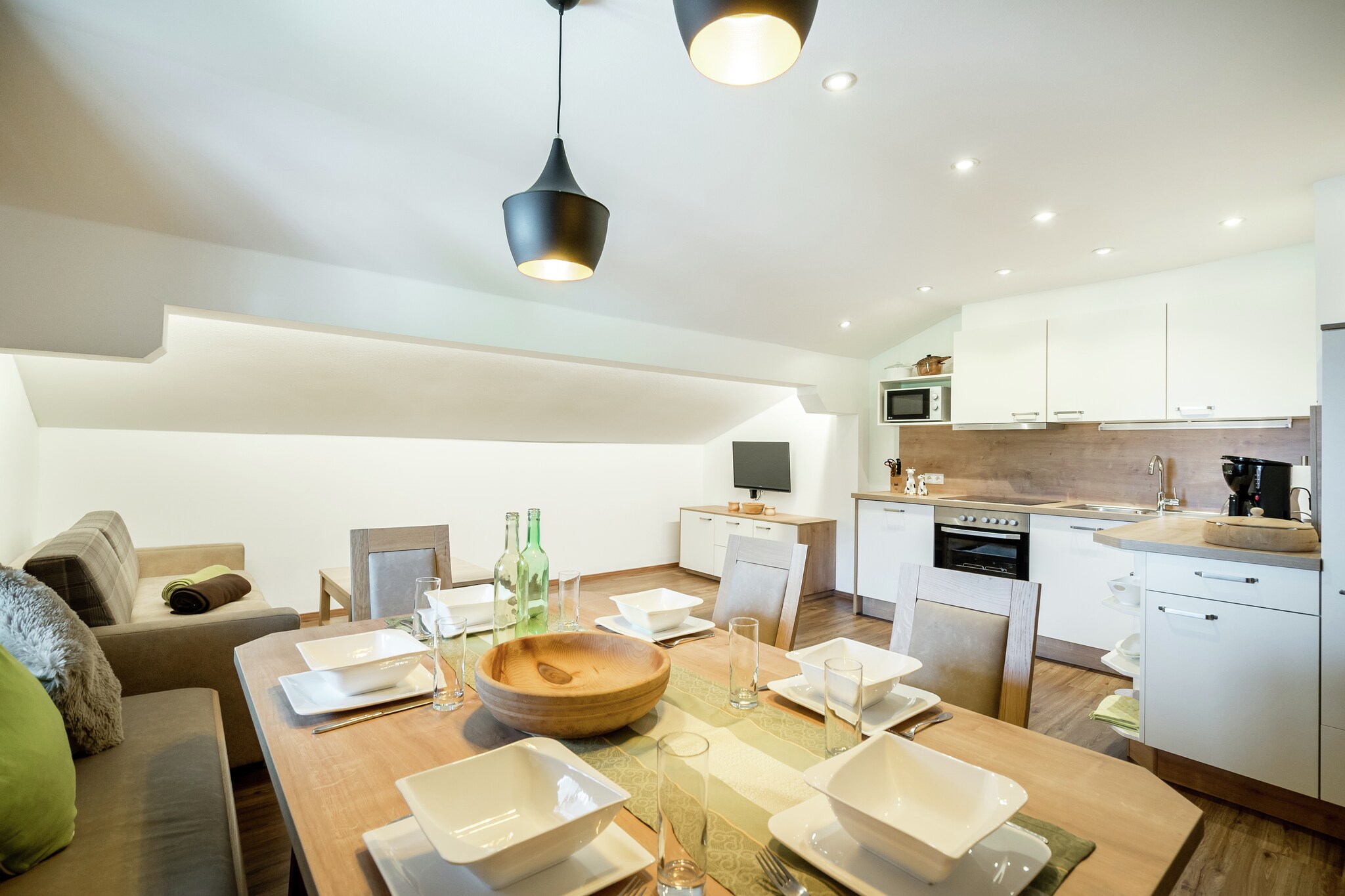 On the 2nd floor: (Living room(TV, balcony), open kitchen(cooker(ceramic), oven, dishwasher, fridge-freezer), Bedroom with bathroom(2x single bed, double bed), Bedroom with bathroom(double bed))\n\nheating(floor heating), garden(shared with other guests), parking, play equipment