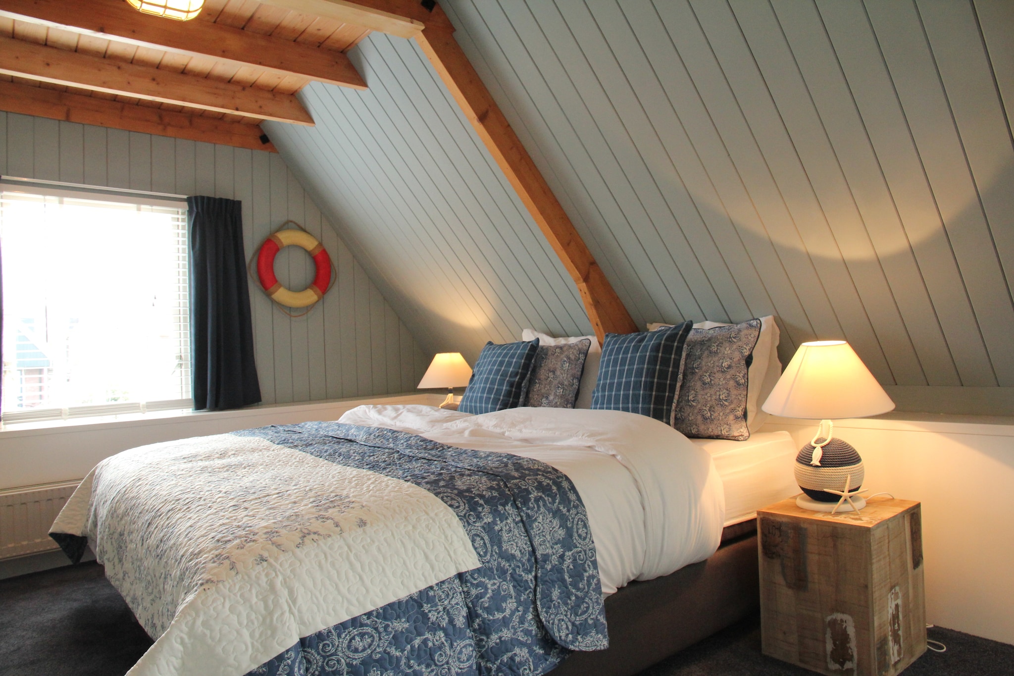 Ground floor: (open kitchen(electric kettle, cooker(gas), coffee machine(filter), oven, dishwasher, fridge-freezer), Living/diningroom(TV(digital, dutch television channels, german television channels), dining table(4 persons), stove(wood), seating area(4 persons)), toilet)\n\nOn the 1st floor: (bedroom(2x single bed(duvet)), bedroom(double bed(two single duvets)), bathroom(shower, 2x washbasin, toilet))\n\ngarden doors, heating(central), garden, garden furniture, BBQ, deckchairs, bicycles available(paid, on request)