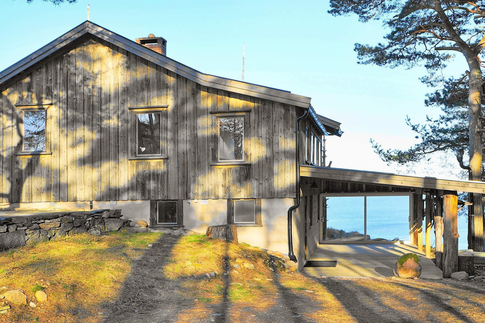 A wonderful holiday home with high standards and an amazing panoramic view over the ocean, located on the island VindÃ¶n. Start the day with an early morning swim from the private bridge, later you can sit down on the patio and admire the amazing view. This is a perfect holiday home for families or couples who got high standards, and would like to be able to relax and feel well during all the seasons of the year. The holiday home is build during the 40Â´s, and where later renovated in 2014 with many of the original details left intact. On the entry you can find a fully tiled bathroom with a beautiful ship door, the laundry room and a bedroom with a double bed. The living room is on the upper floor is equipped with a TV-corner and a inviting wood burning stove and has a exit to the lovely patio which goes around the house and where you will have an amazing view over the Hafstens fjord. There is also a modern kitchen on this level equipped with a gas cooker, followed with two bedrooms where one of them has two folding bunk beds.You can rent a rowing boat, a canoo or/and a motor to the boat. Due to the steep location, the house is not suitable for small children. There is only 40m to the private bridge which belongs to the property (which is sheared with the owner). If you want to go on some lovely bathing or fishing trips there is a boat docked at the bridge which you can rent from the owner. There is some outdoor furniture and a barbeque which you can use to enjoy the incredibly setting. There are several small beaches nearby; to VindÃ¶ns camping there is approximately 1 km, where you can bathe from the beach or the nearby cliffs, there is also the opportunity where you can rent a pedalo, there is also a playground and a convenience store where you can buy fresh bread for breakfast among other things. If you want to visit the Hafsten resort with spa, restaurant, sandy beach and waterslide, there is approximately a 7km car ride away or you can take the boat across the straits (about 1km). There is approximately 9 km to the central town of Henan where you can get all kinds of services, there are also many events organize here during the summer period. The closet supermarket lies in Rotviksbro and is about 5 km away. If you want you go shopping there is Torps shopping center just a few minutes car ride away from you holiday home, which has around 80 different kinds of shops. On Orust you can find many kinds of activities, there is kayaking, diving, fishing, golf or you can just enjoy the tranquility and the beautiful nature in the area. You can also visit the small charming fishing communities named HÃ¤lleviksstrand and MollÃ¶sund. The big city of Gothenburg is 80 km away. Unlimited wireless internet Welcome to a lovely holiday home with a unique setting in BohuslÃ¤n! Good to know:  The motorboat is a rowing boat with an engine. The rowing boat without an engine cannot be booked separately. Bed linen can be purchased at an additional cost. Cleaning is included.