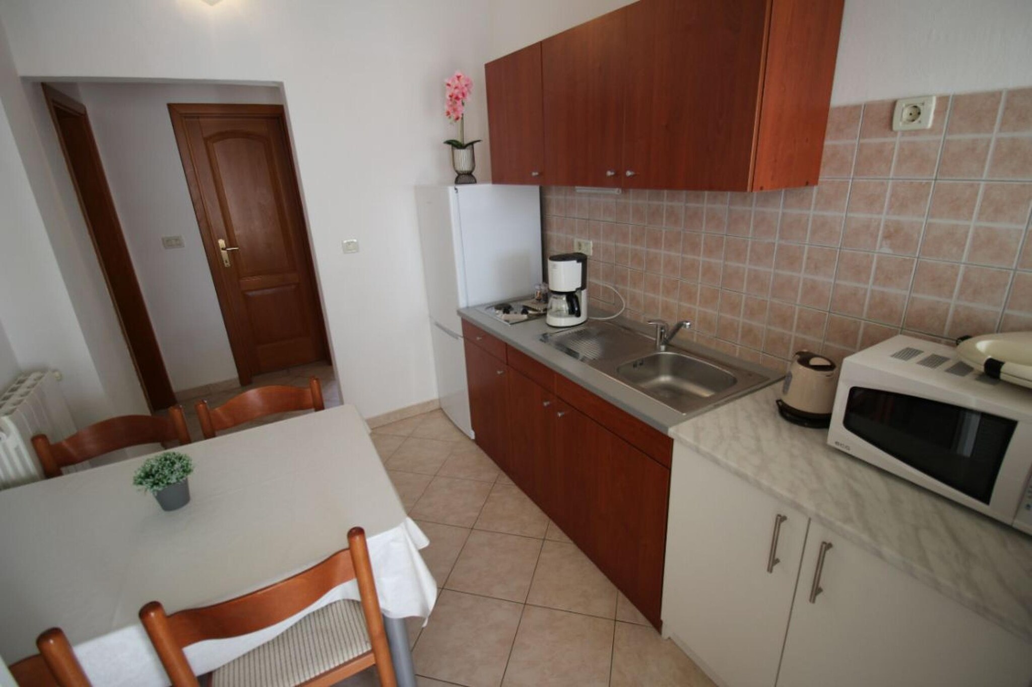 On the 1st floor: (Kitchen(electric kettle, coffee machine, microwave, fridge-freezer, dishes and cutlery), Living/bed room(double sofa bed, TV(satellite), dining table, seating area), bedroom(double bed), bathroom(shower, washbasin, toilet))\n\nInternet access, balcony, air conditioning, parking, swimming pool(shared with other guests)