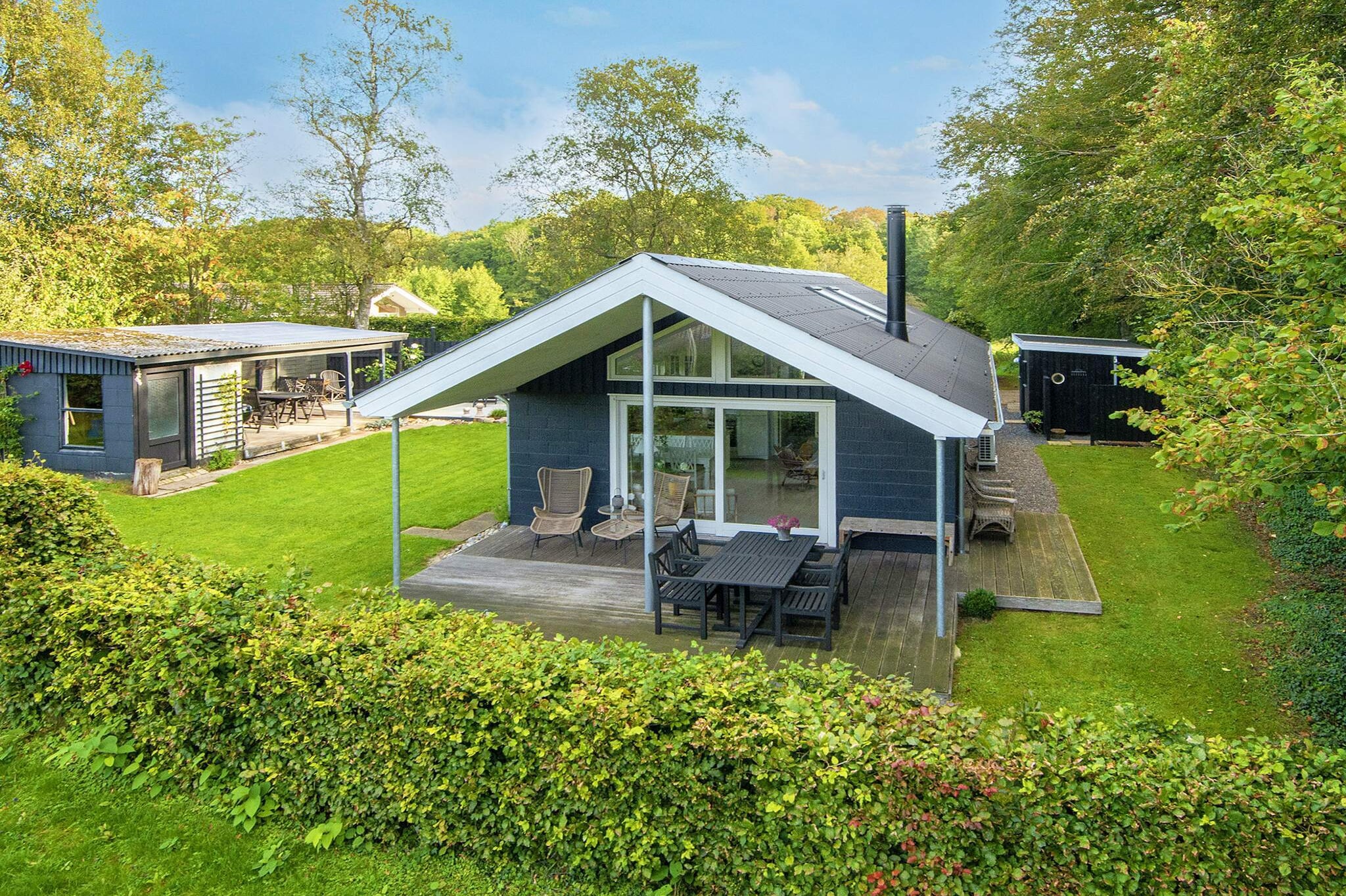 Holiday cottage in Kelstrup Strand with a personal touch and 2 terraces, one is covered and there is a swing and a hammock. There are plenty of play opportunities for the children. The plot borders a small forest area and is very secluded without and passing traffic. You have views of the forest and nature area. The house is located approx. 100 metres from the beach with a jetty.A refundable deposit might be charged closer to your check-in date. The security deposit ensures a smooth stay and covers any additional services or consumption charges.This deposit covers utilities consumed during your stay and any additional services that may be taken.The final amount will be adjusted based on actual meter readings, actual usage of extra services, and any remaining balance will be refunded within 21 days after checkout.This deposit simply acts as a prepayment for charges that  you would anyways pay for, ensuring a seamless stay and check-out experience.