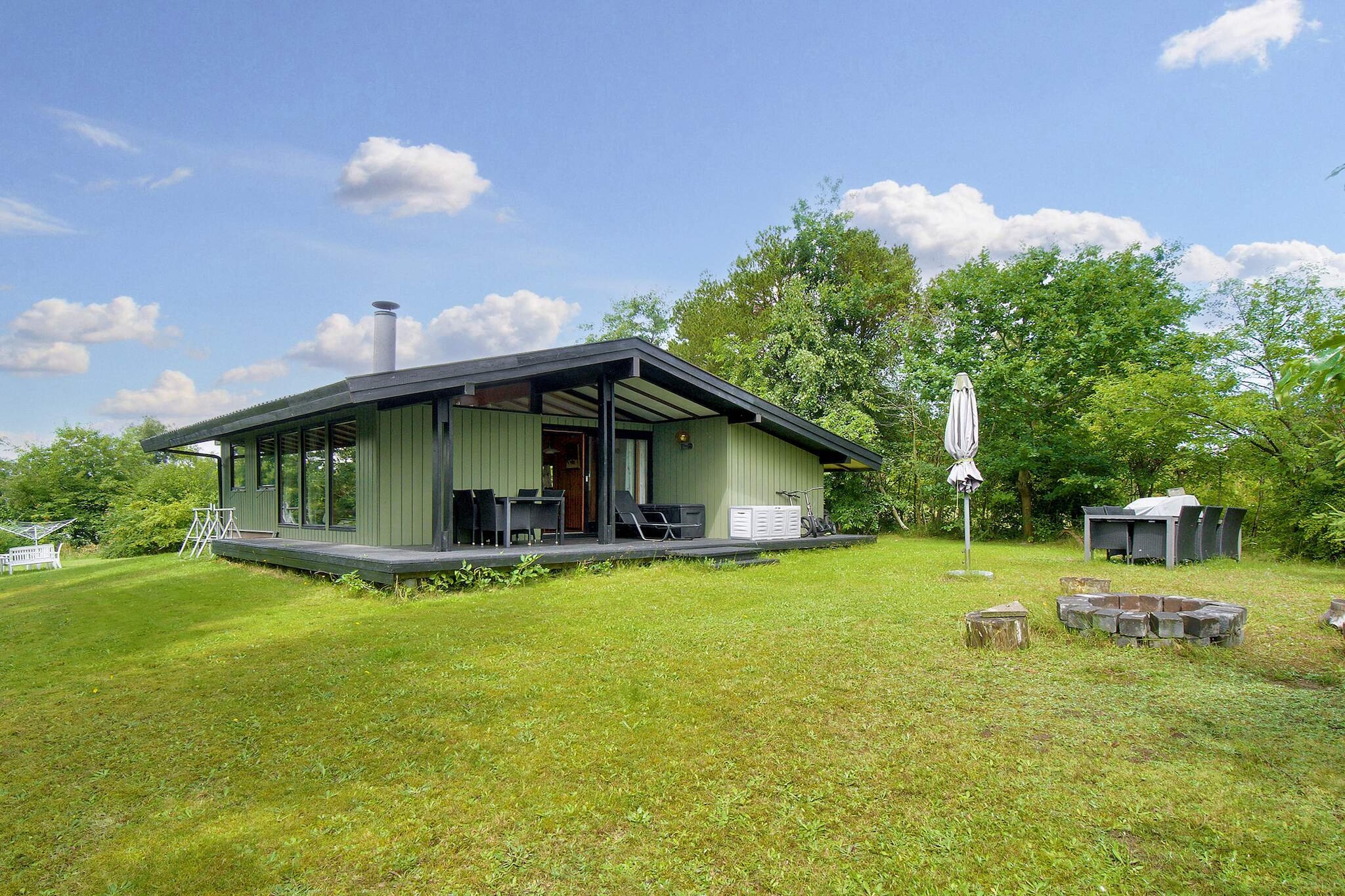 Holiday cottage located within walking distance to Roskilde Fjord. The garden has lawn surrounded by trees, and from the covered terrace you can get a glimpse of the water.A refundable deposit might be charged closer to your check-in date. The security deposit ensures a smooth stay and covers any additional services or consumption charges.This deposit covers utilities consumed during your stay and any additional services that may be taken.The final amount will be adjusted based on actual meter readings, actual usage of extra services, and any remaining balance will be refunded within 21 days after checkout.This deposit simply acts as a prepayment for charges that  you would anyways pay for, ensuring a seamless stay and check-out experience.
