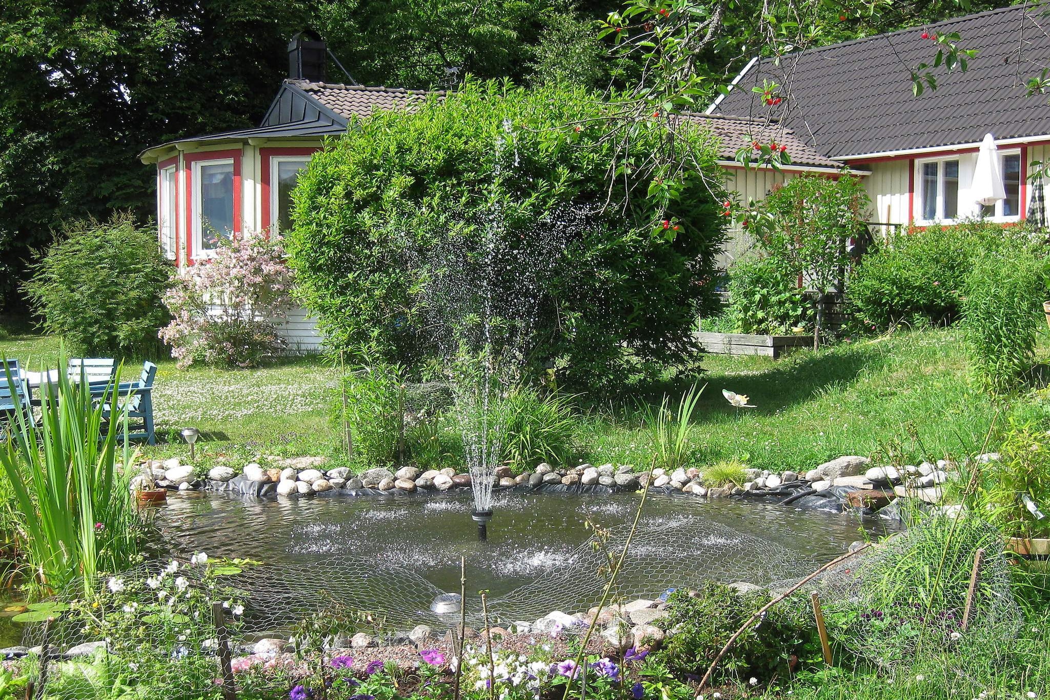 A grand and lovely holiday home located on the island of SvartsjÃ¶landet, which lies approximately 20km away from the heart of Stockholm. The huge and fine lawn is just next to a private shallow beach with bridge and boat. The holiday home has a bright and spicy living area with a modern furnishing. On the ground floor there are two bedrooms and a living room with big window section and with a lovely view over the lake and EkerÃ¶. There is also a dining area, hallway, sauna and an open kitchen area.  The upper floor is an open area with loft style. The holiday home has a large furnished terrace which is perfect for lovely barbecues, where you can enjoy the beautiful view over the lake and beach. Where you will find fine bathing and fishing opportunities, and if you only want to enjoy the moment you can find peace and relaxation at the furnished pier at the beach. The surrounding area is calm and perfect for pleasant boat trips. Just a few km away you can find some of the best golf courses in the whole of Sweden. There is a riding school located about 1km away from the holiday home. During the winter period there is opportunity to go skating and skiing. There is a cross country ski trail as well ski slope with lift, not far away from the holiday home. The grund is joint, but separate.