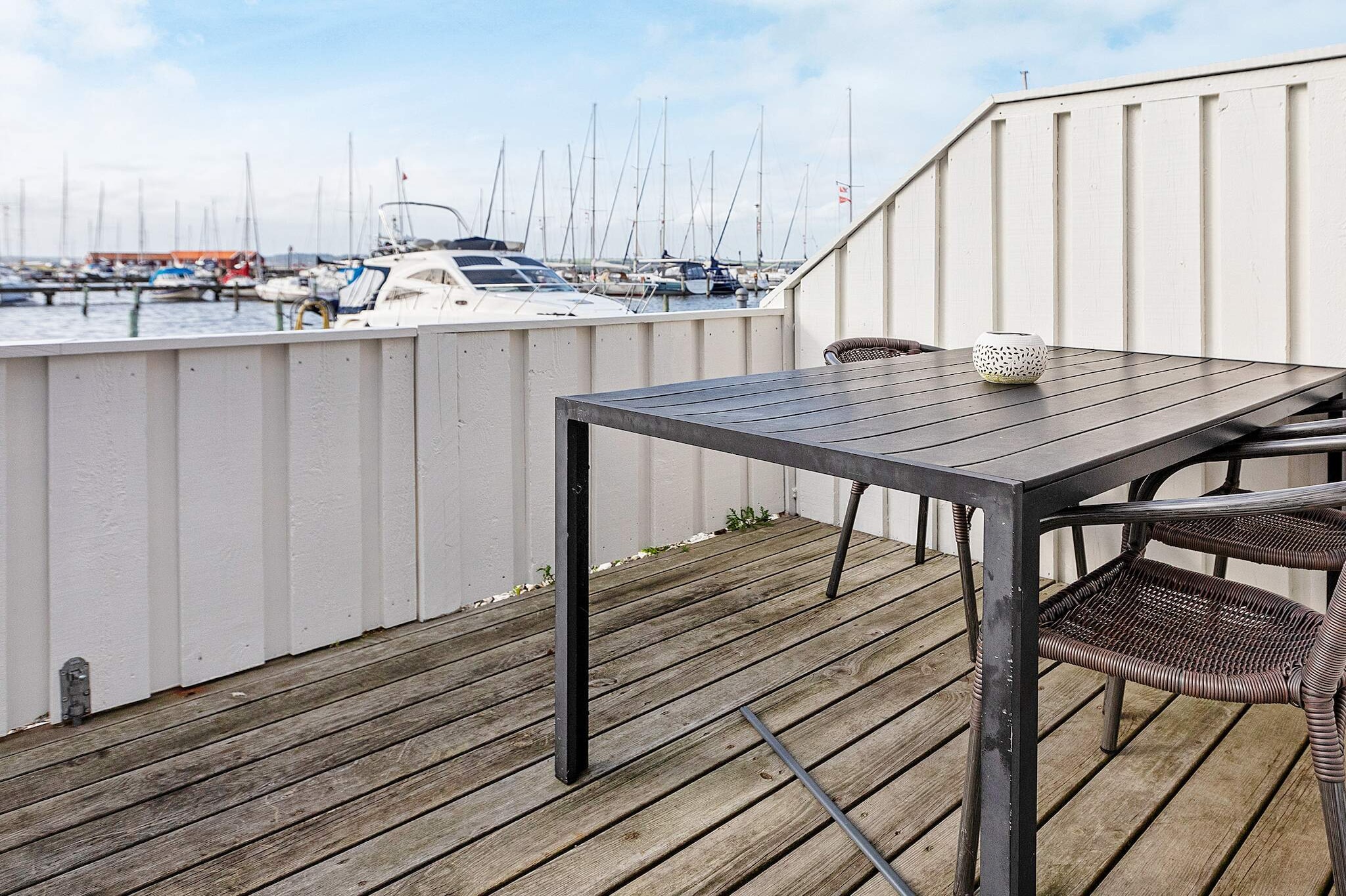 Holiday cottage located directly on the quay at Nibe Marina. Great views over the marina, the bay and the whole area. The house includes a combined living room and kitchen (1 sofa bed), a double bedroom and a 16 m² large mezzanine with two beds and a bathroom. Washing machine and dryer. There is 12 m² terrace approx. 10 m from the water with a wonderful view of life on and around the marina. In addition, 24 m² enclosed patio. At one end of the harbour there is a large harbour bath with changing rooms and sun terrace, and at the other end there is a beach with a jetty.A refundable deposit might be charged closer to your check-in date. The security deposit ensures a smooth stay and covers any additional services or consumption charges.This deposit covers utilities consumed during your stay and any additional services that may be taken.The final amount will be adjusted based on actual meter readings, actual usage of extra services, and any remaining balance will be refunded within 21 days after checkout.This deposit simply acts as a prepayment for charges that you would anyways pay for, ensuring a seamless stay and check-out experience.