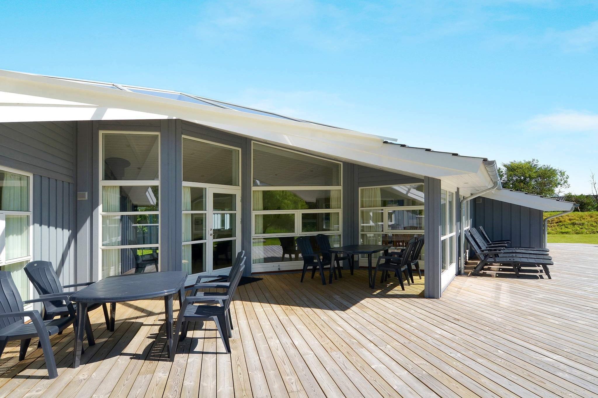 Internet Access DSL, Living room(2x single folding bed), open kitchen(cooker(electric), hood, coffee machine, microwave, dishwasher, fridge-freezer, washing machine), Living/bed room(TV(cable, german television channels, danish TV channels (DR1 and TV2)), DVD player), bedroom(double bed), bedroom(double bed), bedroom(2x single bed), bathroom(floor heating)(bathtub or shower, washbasin, toilet), bathroom(floor heating)(bathtub or shower, washbasin, toilet), carport, Bubble bath(indoor, heated, 2 persons), sauna(indoor, heated, 5 persons), heating(electric), terrace, play equipment, air to air heatpump