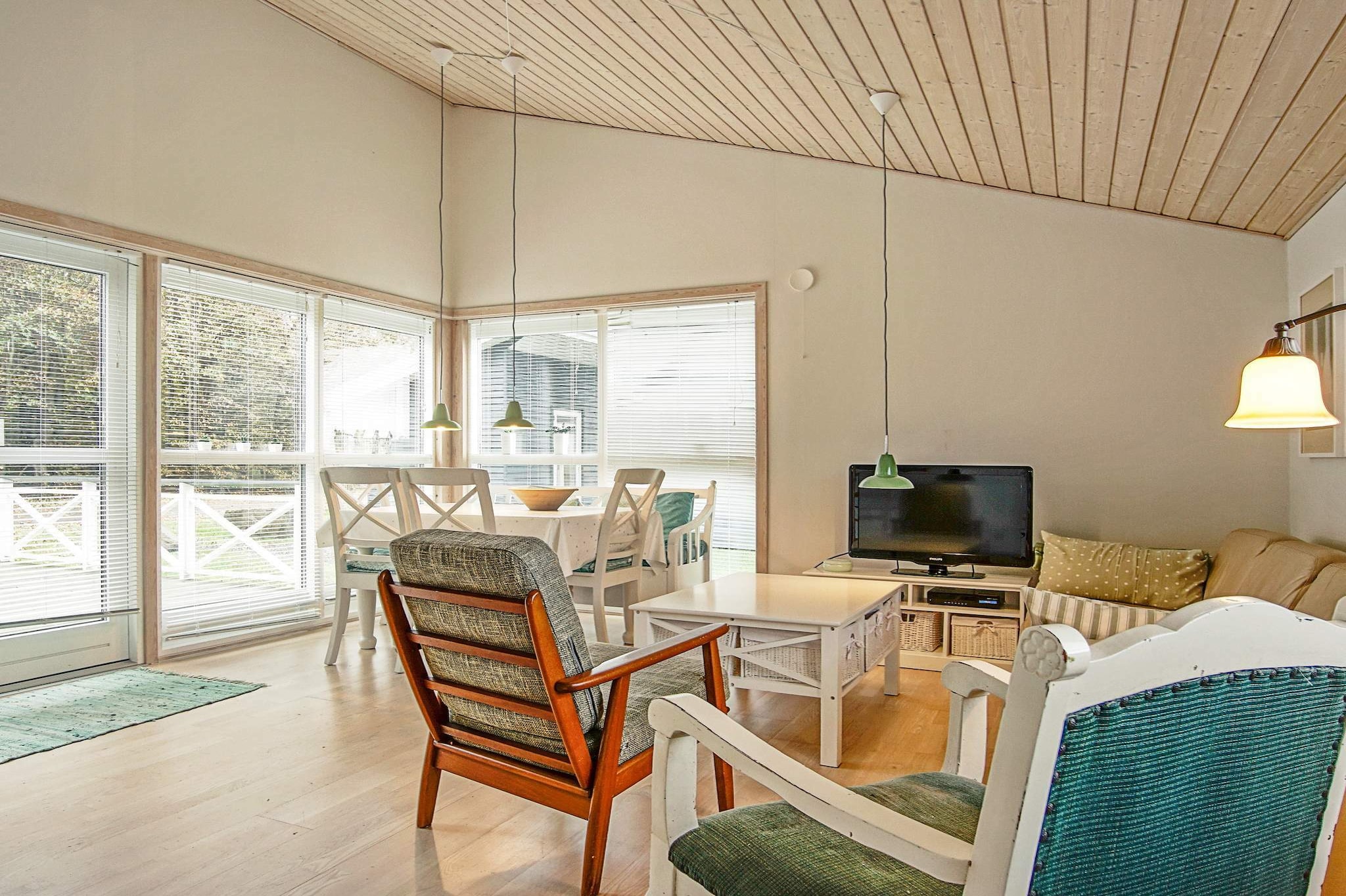 Annex: (2x single bed)\n\nInternet Access DSL, open kitchen(cooker(electric), hood, coffee machine, dishwasher, fridge, freezer(60-99L), washing machine), Living/bed room(TV(satellite, danish TV channels (DR1 and TV2)), DVD player, CD player, stereo unit, high chair), bedroom(double bed, cot), bathroom(floor heating)(bathtub or shower, washbasin, toilet), heating(electric), terrace(30 m2), BBQ, air to air heatpump