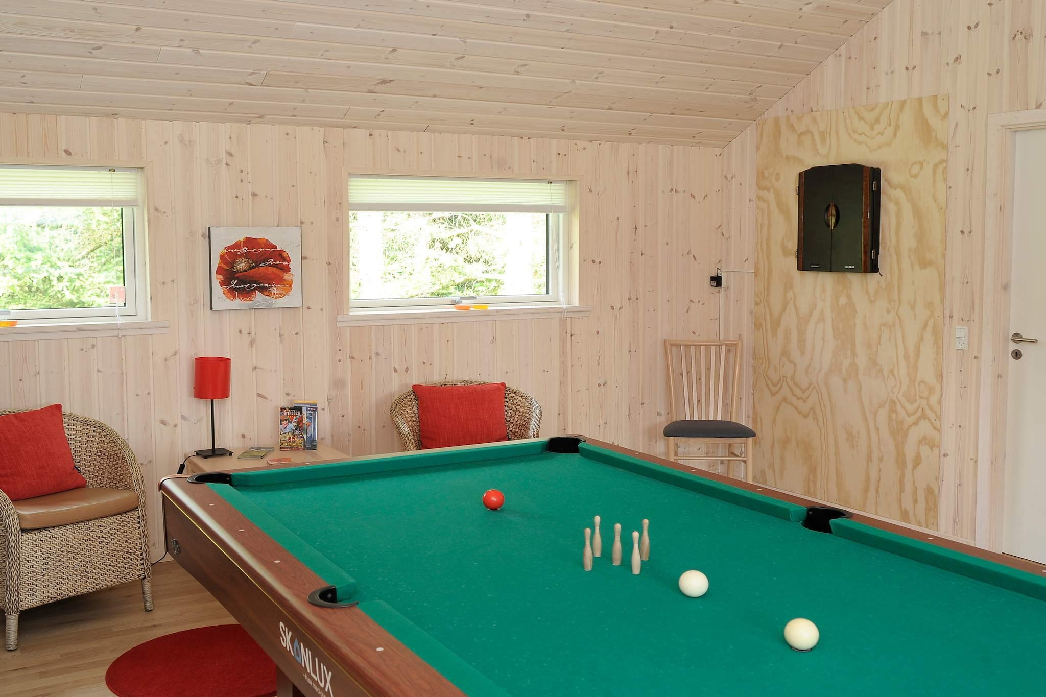 open kitchen(cooker(electric), hood, coffee machine, microwave, dishwasher, fridge, freezer(60-99L), tumble dryer, washing machine), Living/bed room(TV(german television channels, danish TV channels (DR1 and TV2)), CD player, stereo unit, high chair), bedroom(double bed, children\'s bed), bedroom(double bed), bedroom(2x single bed), bathroom(floor heating)(bathtub or shower, washbasin, toilet), bathroom(floor heating)(bathtub or shower, washbasin, toilet), mezzanine(2x single folding bed), carport, game computer, Bubble bath(indoor, heated), sauna(indoor, heated), heating(electric), terrace, BBQ, play equipment, table tennis table, darts, billiards, fish cleaning table, air to air heatpump