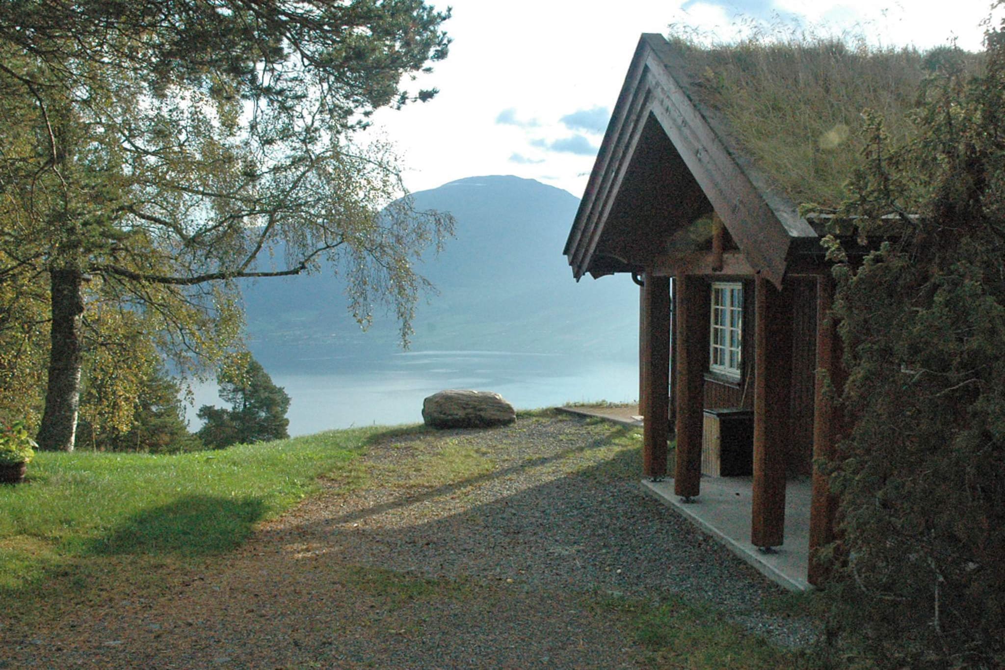 Great holiday cottage built in 2010, secluded location high above Nordfjorden, with a panoramic view of fjord, mountains and small towns. Situated at 350 masl., this cottage is the perfect getaway place to relax and enjoy the scenery. The closest neighbour is 150 meters away. The cottage is large and spacious, and wheelchair accessible on the ground floor. The double bed has a continental mattress. One bedroom has a 120 cm wide bed, the lower bunk in another bedroom is also 120 cm wide. There is a spacious mezzanine. 30 m² open terrace where you can enjoy the view. Go swimming 3 km away on a bare rock-face. The river Strynselva with salmon and trout, 16 km. The lake Ulvedalskjenna with big-sized trout, is 1 km away, and canoe rental for 3-4 people is NOK 50 per day. The town Stryn has shops and restaurants, 16 km away. Briksdalen Glacier is 93 km away, West Cape 115 km, Geiranger 93 km, Runde 176 km, Ålesund 201 km.