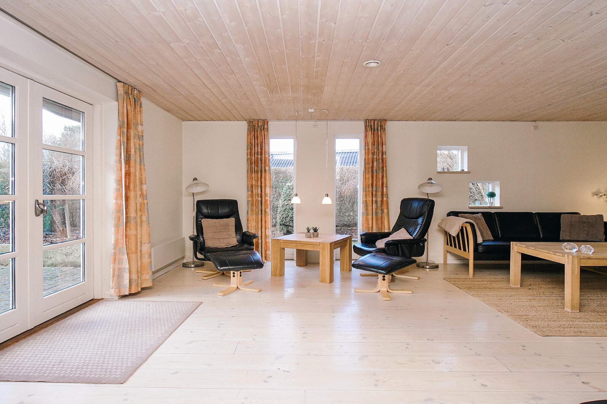 Annex: (double bed)\n\nopen kitchen(cooker(electric), hood, coffee machine, microwave, dishwasher, fridge, freezer(60-99L), tumble dryer, washing machine), Living/bed room(TV(german television channels, danish TV channels (DR1 and TV2))), bedroom(double bed, children\'s bed), bedroom(double bed), bathroom(floor heating)(bathtub or shower, washbasin, toilet), carport, heating(electric), terrace, terrace(roofed), BBQ, air to air heatpump