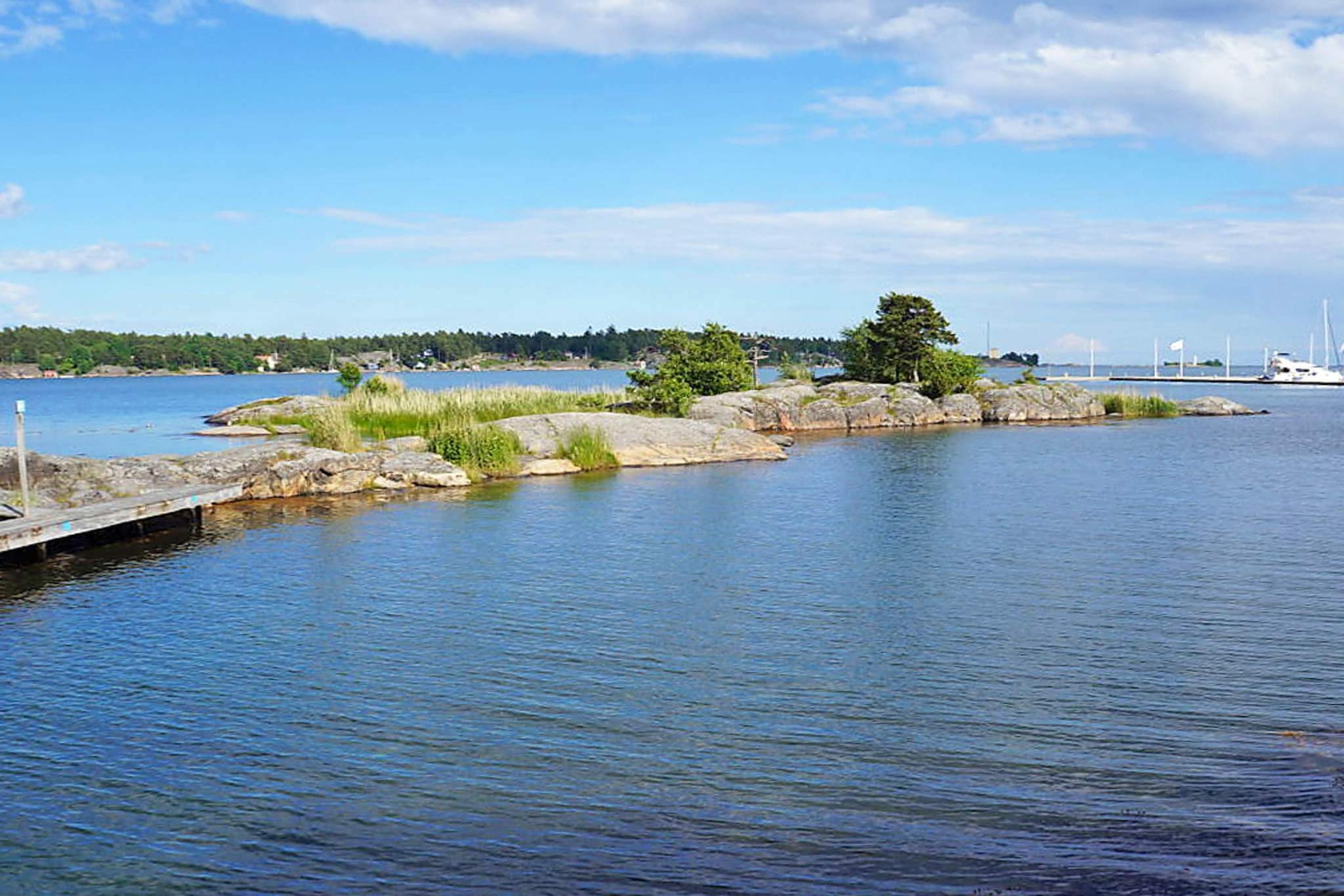 Welcome to this picturesque little cottage in ArkÃ¶sund, close to the archipelago which is known as one of the pearls of the Baltic Sea. The cottage is located on a shared plot of land with the owner, but is still quite secluded and built 2013 with a very tasteful design. The cottage has an open plan design with a living room, kitchen and entrance hall. The living room holds a coyy sofa for pleasant evenings together while watching TV or just relaxing. In addition there is a dining area and kitchen. The superb kitchen includes all amenities such as a cooking hob, fan, oven, dishwasher and microwave, everything you could need to cook delicious meals. Also, from the kitchen there is a direct exit to one of the large balconies with a beautiful view of the ocean. The cottage features two bedrooms, one with two beds and one with a bunk bed. Both rooms have direct access to the cottage's other large balcony. The outdoor areas have garden furniture and there is a barbecue grill. Finally the cottage features a fully tiled shower room with a WC, washing machine, tumble dryer and drying cabinet. Both of the balconies are guaranteed sunlight and are lovely for nights outside. It is only 5-10 minutes to the centre of ArkÃ¶sund with grocery stores, an outdoor swimming pool, exhibitions, Saturday night entertainment such as music venues and pubs, and much more. You can also rent a canoe for a trip out in the archipelago if you would like to visit some of the islands. The area also offers a lot to do for day trips such as SÃ¶derkÃ¶ping (located about 50 km away) the picturesque town on the eastern end of GÃ¶ta Canal. If you are interested, Stockholm is just about 200 kilometres away and is an attractive destination that is perfect for a nice day trip.