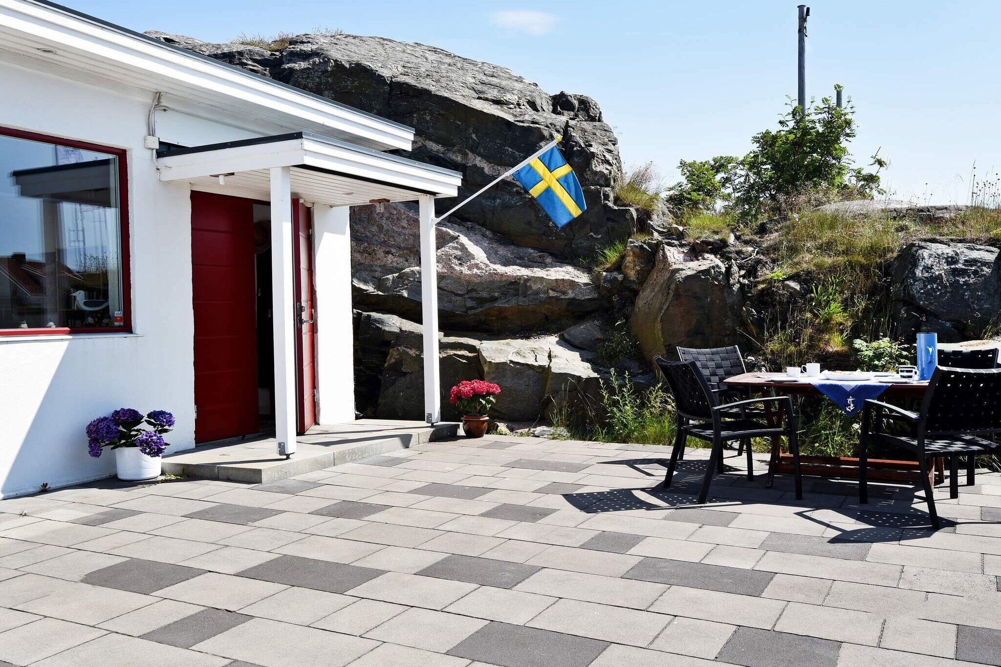This charming holiday home is set in the centre of SkÃ¤rhamn, on the  island of TjÃ¶rn.It features a great terrace by the water, offering a  magnificent view of the harbour. In the garden you will find yet another  pleasant area for relaxing and having tea.  The interior of the  house is tastefully decorated in a navy style. The lovely open plan  kitchen and living room gives you a beautiful view of the harbour,  through the windows. In the living room you will find a cosy TV-area   and a TV with 30 Swedish and English speaking channels. There is also a  modern sofa bed that fits two people.The bedroom features two single  beds . There is also a charming mezzanine containing one bed, in the  living room. A curtain makes it private and cosy in the mezzanine. The  bathroom is beautiful, featuring a WC, wash basin, shower cubicle and  underfloor heating. You will get to use your own part of the landlord's  delightful garden, complete with an outdoor sitting area.  There  is an excellent beach, GrÃ¥skÃ¤rsbadet, located only 400 metres from the  cottage. This is an excellent place for children to play and try crab  fishing.  It offers sandy beaches and a bathing dock. SkÃ¤rhamn offers  plenty of entertainment and culture for instance lovely art museum  specialising in aquarelles.  Your holiday home is within walkin distance  of most services, such as restaurants, shops and grocery stores. Why not  visit the lovely towns in the archipelago? KlÃ¤desholmen and Kyrkesund  to mention a couple.Within a wider distance, you will find RÃ¶nnÃ¤ng dock,  where you can dine or catch a ferry to the islands of Ã…stol, TjÃ¶rnekalv  and DyrÃ¶n. Gothenburg, Swedens second largest city, is only 65  kilometres away!  Please note: A part of the building functions as a garage. The holiday home is located by a road.  Welcome to this great holiday home with it's stunning view.