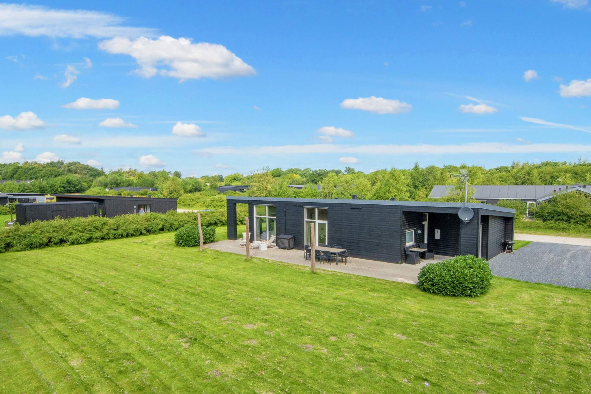 Welcome to this spacious and modern holiday home near the beautiful Fjellerup Beach, set in a peaceful summer house area by a small lake and close to Meilgårdsskoven forest. Perfect for families or groups of up to 8 guests, the home offers 4 comfortable bedrooms (2 with double beds, 2 with twin beds) and a bright, open-plan living space equipped with satellite TV, stereo with CD player, and a high chair for little ones. The well-equipped kitchen includes an electric stove, refrigerator with freezer, microwave, extractor hood, dishwasher, coffee maker, washing machine, and dryer—everything needed for a hassle-free holiday. A modern bathroom features a shower, underfloor heating, sink, and WC. Step outside and enjoy 1,140 m² of natural grounds, complete with a furnished terrace, covered dining space, barbecue grill, and play equipment for children. Electric heating and a heat pump ensure year-round comfort. Located in the heart of nature, this home is ideal for relaxing evenings or exploring the area’s scenic landscapes. Fjellerup Strand is known for its wide sandy beaches, high chalk cliffs, and fossil hunting along the Kattegat coast. The surrounding forests and valleys offer excellent opportunities for cycling, hiking, and running, while nearby ferries across Randers Fjord (like Mellerup-Voer and Udbyhøj) add a local touch of adventure. Whether you're after nature, beach days, or outdoor activity, this inviting home in Norddjursland offers a fantastic base for your Danish holiday escape.A refundable deposit might be charged closer to your check-in date. The security deposit ensures a smooth stay and covers any additional services or consumption charges.This deposit covers utilities consumed during your stay and any additional services that may be taken.The final amount will be adjusted based on actual meter readings, actual usage of extra services, and any remaining balance will be refunded within 21 days after checkout.This deposit simply acts as a prepayment for charges that  you would anyways pay for, ensuring a seamless stay and check-out experience.