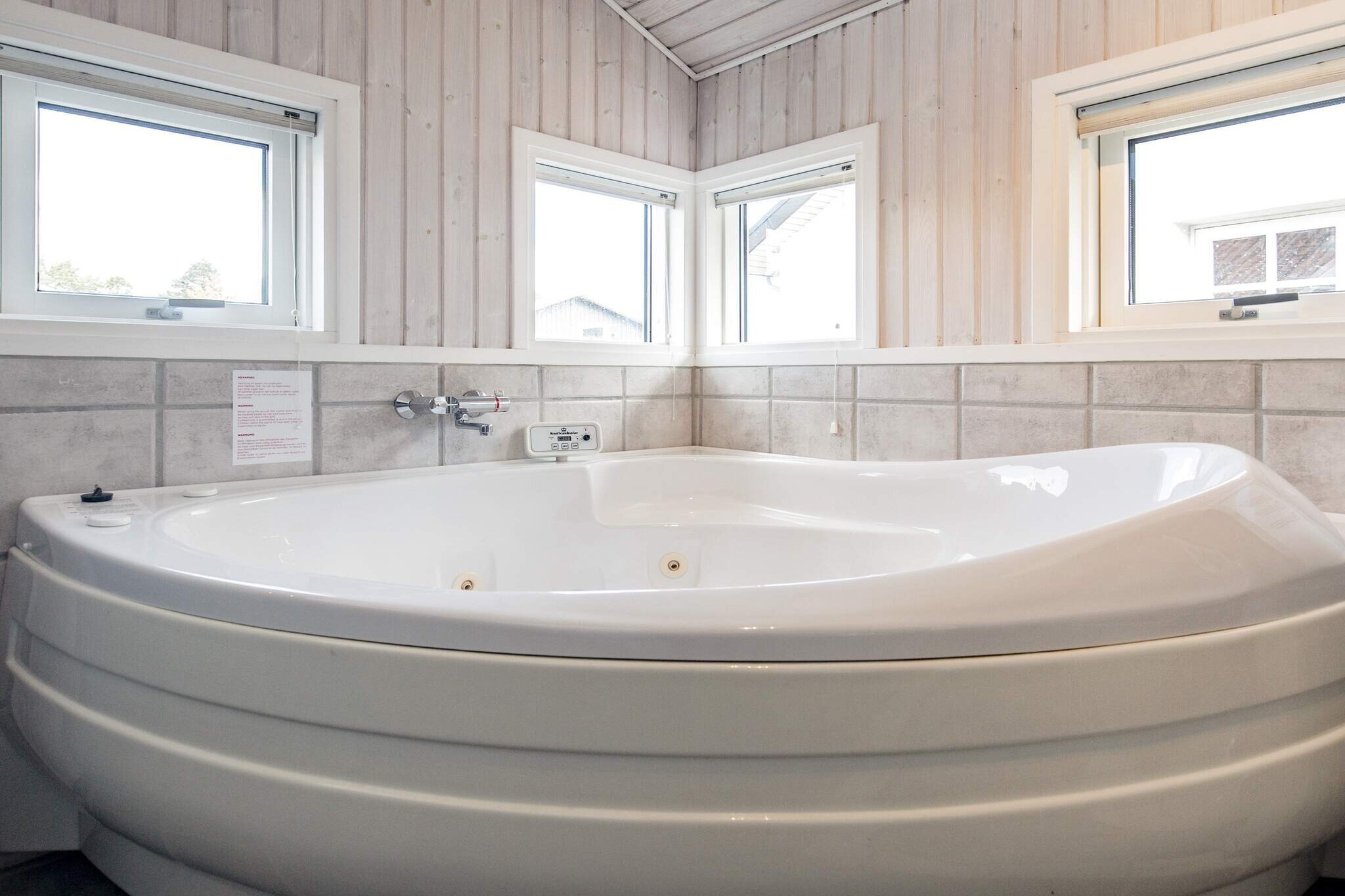 Holiday cottage with whirlpool and sauna located approx. 100 m from the ocean on a a large natural plot bordering a large protected area. Bright furnishings with 3 bedrooms and a large mezzanine. Bright kitchen with ceramic cooker and 40 litres freezer. Combined living room/dining room/kitchen with exit to the terrace. The beach has a jetty and in the area there is a large shared area where you can play ball games. The nearby camp site has various playground toys. A refundable deposit might be charged closer to your check-in date. The security deposit ensures a smooth stay and covers any additional services or consumption charges.This deposit covers utilities consumed during your stay and any additional services that may be taken.The final amount will be adjusted based on actual meter readings, actual usage of extra services, and any remaining balance will be refunded within 21 days after checkout.This deposit simply acts as a prepayment for charges that  you would anyways pay for, ensuring a seamless stay and check-out experience.