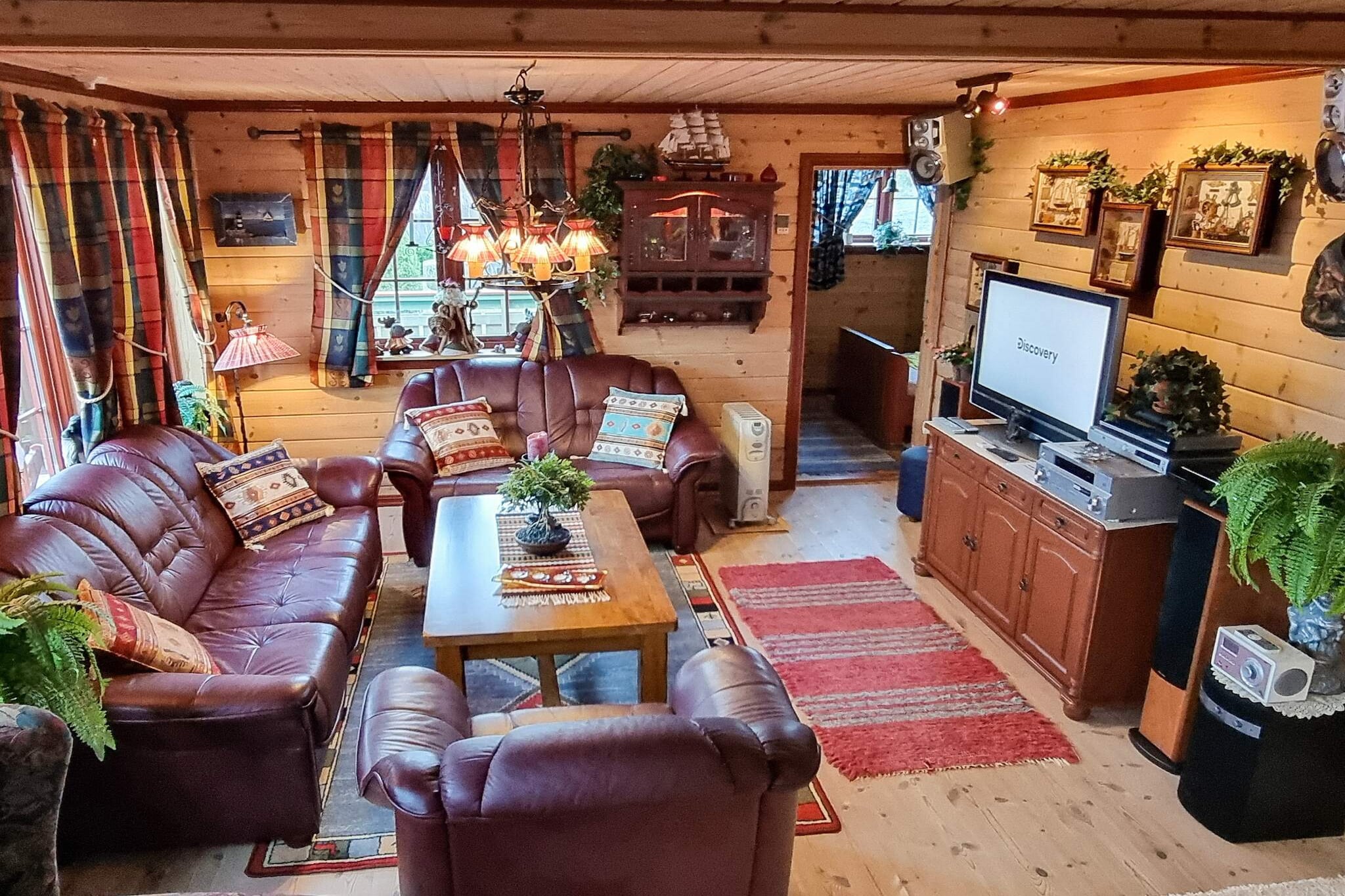 Beautifully located holiday cottage with a panoramic view of the sunset, the islands and the steep mountains along one of the world's most beautiful fjords - Hjørundfjorden. Midsummer you have sun all day, with sunrise at 04.30 and sunset at 23.30. The house is only 80 meters from the fjord with nothing to block the view. A couple of other holiday cottages are located behind. You can sit on the 50 m² open terrace or the 15 m² covered terrace and watch cruise ships sail by. Lovely garden and yard with lighting. The holiday house is well equipped with gas grill (outdoors), some TV-games (Norwegian and English ones,Playstation 3 with some German games, Gamecube machine with 5 games, Gameboy pocket with approx. 35 games), internet via fibre cable with 100 Mbits high speed, coffee machine, waffle iron, toaster, electric kettle, griddle, blender, etc. 10 m² large awning. The sleeping arrangement in the upstairs living room are two folding extra beds with comfortable mattresses. Same type of extra bed in in the bedroom. 2 cots. Shower in the indoors whirlpool for 1-2 people. The outdoor massage bath fits 6-7 people, and you can regulate the temperature while enjoying the spectacular view. In the bathroom, there is a shower adjacent to the bath tub. 200 meter to a small harbour, where a motorboat is available for rent (including life jackets). The boat has automatic drainage, inboard diesel engine (not expensive in use), large and closed cubicle that fits 10 people, 2 sonars, chartplotter, radar, autopilot, reel, 2 deck lights and headlight on the roof, 2 rod holders, fishing equipment, pyro-galley, toilet, walkie-talkie, vhf radio, and stereo with an aux entrance for mobiles. A covered fish cleaning table at your disposal. The fishing conditions in the fjord are great. Outdoors swimming pool in summer and restaurant 10 km. Small beach with shallow water 1 km. Signed mountain hiking trails, 1 km to the closest. 15 km to the town of Sykkulven. The salmon and trout river Straumselva 18 km. 4 km to a lake with small trout. Alpine skiing in winter 20 km away. Hellesylt is 60 km away, where you can take the gorgeous cruise ride to Geiranger.