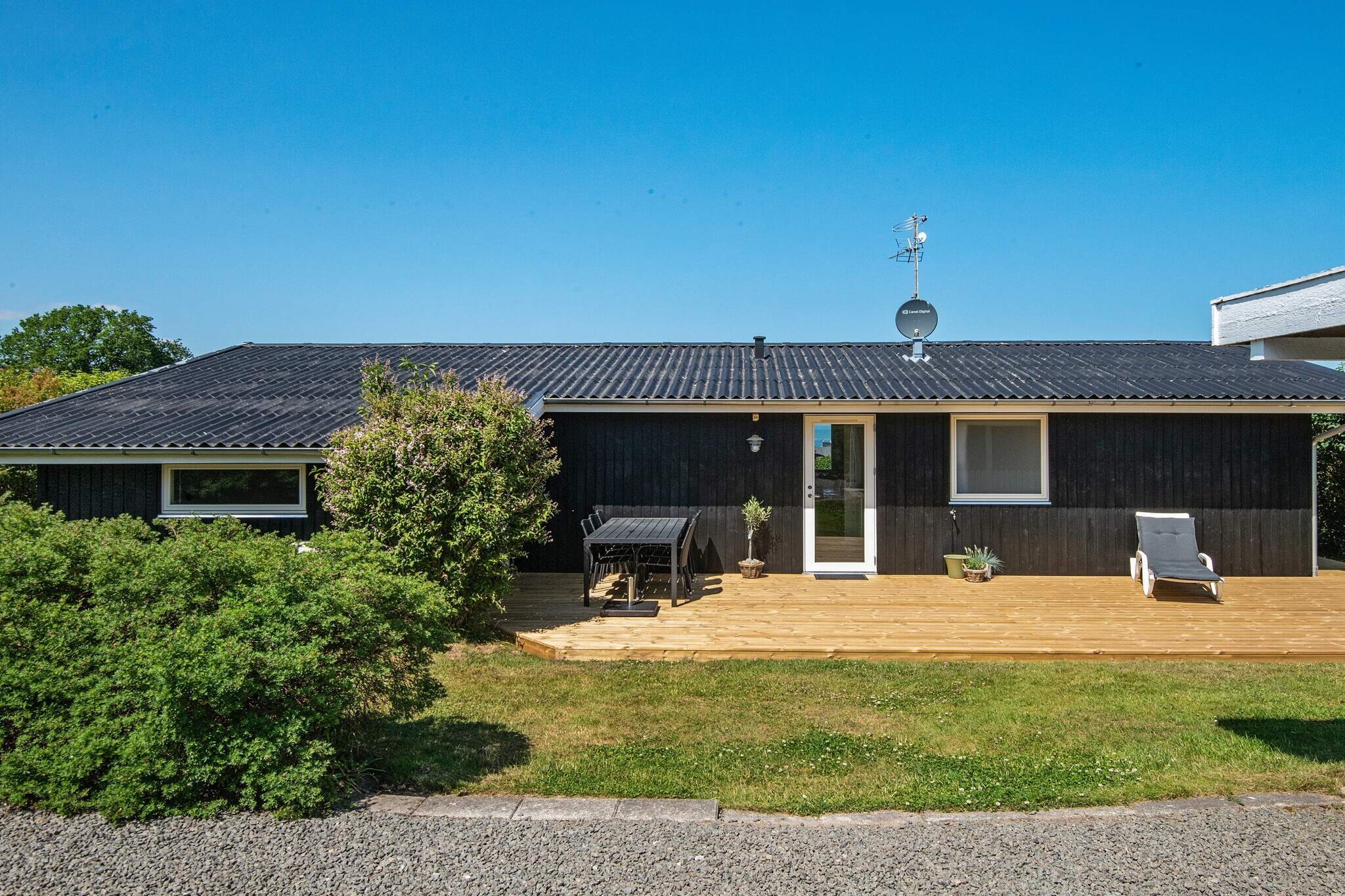An elevated holiday cottage with an outstanding view from kitchen, living room and bedroom. The house has a well equipped kitchen, where you can enjoy a nice meal at the dining table. You can freely use the large plot that surrounds the cottage, for e.g. ballgames. From the terraces (40 m² open terrace and 30² covered terrace) you have a fantastic view of the area and you can look over to the beach. The beach is only 2 min. walking away and is a fine beach suitable for children. There is a kiosk on the camp site approx. 300 m from the house.A refundable deposit might be charged closer to your check-in date. The security deposit ensures a smooth stay and covers any additional services or consumption charges.This deposit covers utilities consumed during your stay and any additional services that may be taken.The final amount will be adjusted based on actual meter readings, actual usage of extra services, and any remaining balance will be refunded within 21 days after checkout.This deposit simply acts as a prepayment for charges that  you would anyways pay for, ensuring a seamless stay and check-out experience.