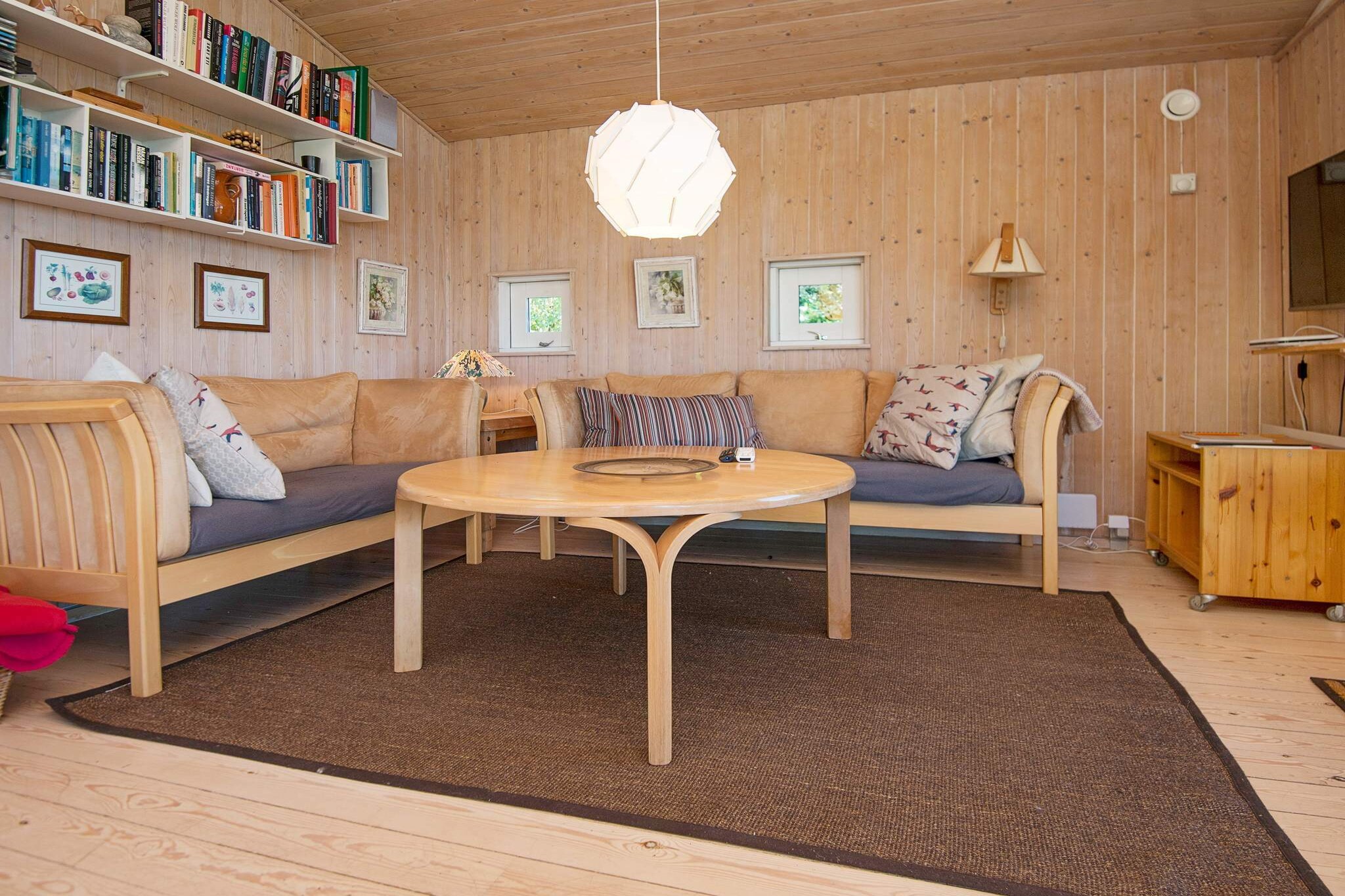 High located holiday cottage with bright furnishings. All of one side of the house with the living room faces a lake and the plantings around it create a special view. Right of the house you have panoramic views of Kattegat from the terrace which is covered. From here you can observe the ferries and ships. Open concept kitchen and living room which means you can spend time together while preparing dinner. 3 bedrooms and an annex, located below the house and not far from the lake. From here you can also observe the ships. A refundable deposit might be charged closer to your check-in date. The security deposit ensures a smooth stay and covers any additional services or consumption charges.This deposit covers utilities consumed during your stay and any additional services that may be taken.The final amount will be adjusted based on actual meter readings, actual usage of extra services, and any remaining balance will be refunded within 21 days after checkout.This deposit simply acts as a prepayment for charges that  you would anyways pay for, ensuring a seamless stay and check-out experience.