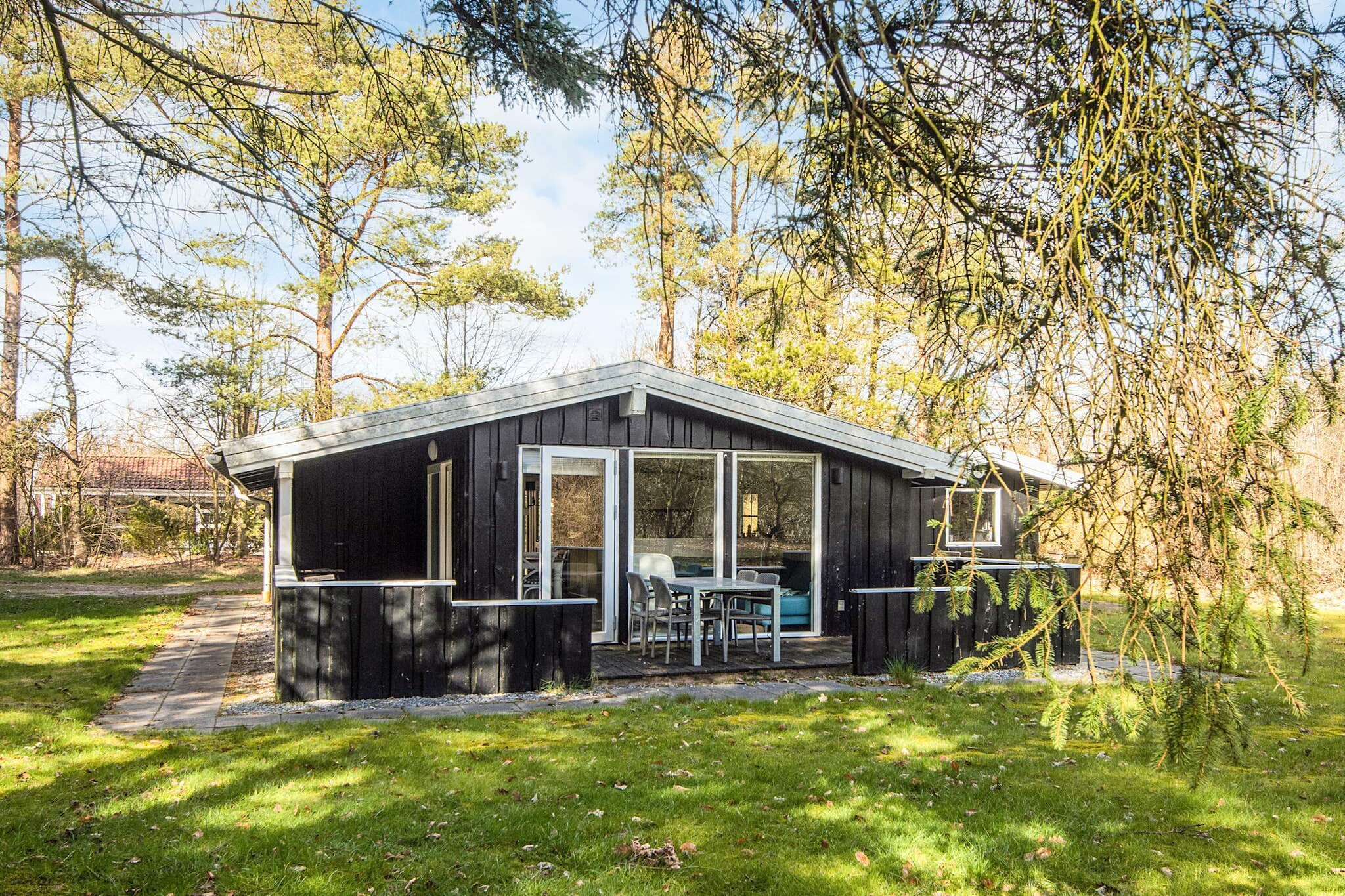 Holiday cottage located on a cul-de-sac on a natural plot surrounded by trees. The house was renovated in 2018 and has i.a. energy-efficient heat pump and 50/50 Mbit internet. The house is only 43 m2 but the cosy and bright furnishings and layout make it feel much bigger. From the combined living and dining room in open connection to kitchen you have views of the surrounding nature through the large window sections. Here you can watch TV or play boardgames. Besides the bathroom with shower, washer and underfloor heating there are 3 bedrooms with a total of 5 beds.A refundable deposit might be charged closer to your check-in date. The security deposit ensures a smooth stay and covers any additional services or consumption charges.This deposit covers utilities consumed during your stay and any additional services that may be taken.The final amount will be adjusted based on actual meter readings, actual usage of extra services, and any remaining balance will be refunded within 21 days after checkout.This deposit simply acts as a prepayment for charges that  you would anyways pay for, ensuring a seamless stay and check-out experience.