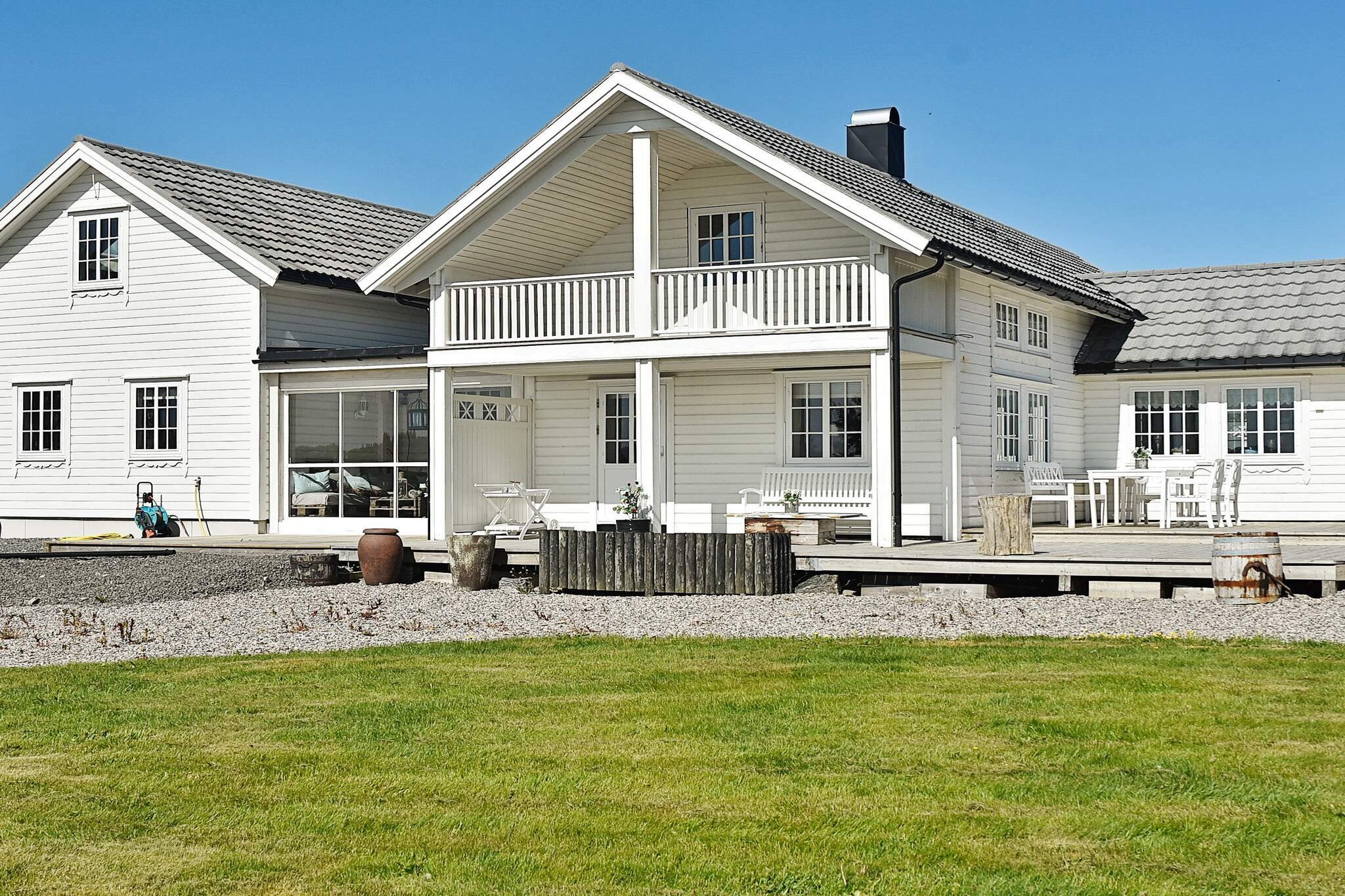 The perfect holiday cottage with whirlpool, located on a large, south-facing property with a view. 70 metres to a sandy beach and private shoreline, 200 metres to harbour with rental boats. There is an annex / activity house of 23 m² for indoor activities like table tennis, film screen with projector, PlayStation, kettlebell, hula hoop, exercise equipment, games, etc. This is a well-equipped cottage with everything you need for your holiday. It was completely renovated between 2005 and 2016, with an extension in 2014. Several TVs with international channels, netflix, apple-TV and sonos wireless speaker system throughout the house. 25 MB internet speed. Bathroom with a 1-2 person whirlpool. Main living room on the ground floor with a fireplace and intimate loft room with a corner sofa that can be used as a double bed. Panoramic view from a covered balcony. There is a small dining section connected to the kitchen and a large dining room that fits 10 people. Very well-equipped kitchen with sous vide supreme, food processor, rice cooker, raclette, wok, electric kettle, waffle iron, toaster, egg boiler, etc. ! The extension for 2014 consists of a bedroom on the ground floor where there also is a kitchen no. 2 with an office space and a double extra bed/sofa bed, a bathroom with "ceiling shower". Large loft room with piano PlayStation and TV. Sunroom with glass doors, terrace heater, sofa and table. 210 m² terraces with outdoor furniture. There are football goals (small), trampoline, sandbox, football tennis, croquet, badminton, boccia, etc. Weber gas grill, BBQ gourmet roaster (large coal-fuelled grill) and bonfire pan with equipment. A large wood-fuelled bath barrel and a small annex with a wood-fuelled sauna. 200 metres to an artificial grass field and playground for children. The fjord is suitable for kiting. 500 metres to signed hiking trails in heathery hills and forests. 11 km to a salmon and trout river. 6 km to the closest trout lake. 200 metres to the floating dock in the harbour where you can rent a Dolmøy 230 (2013 model) with a closed cabin for 6 people with heating, steering wheel, 90 hp Selva 4-stroke motor with chart plotter, gps and sonar. You can rent several boats upon request when booking the house, provided that you also rent the Quicksilver boat and Dolmøy 230. A covered fish cleaning table by the house. Life jackets included in the rent. There is a room in the barn building for storing equipment and drying clothes. Bradley smoker for smoking fish. The owners of the house use it occasionally during times when it is not rented out. There are also two cats on the property that you can feed or bring in to the house if you like. The single beds can be combined and one the double beds is 120 cm wide.