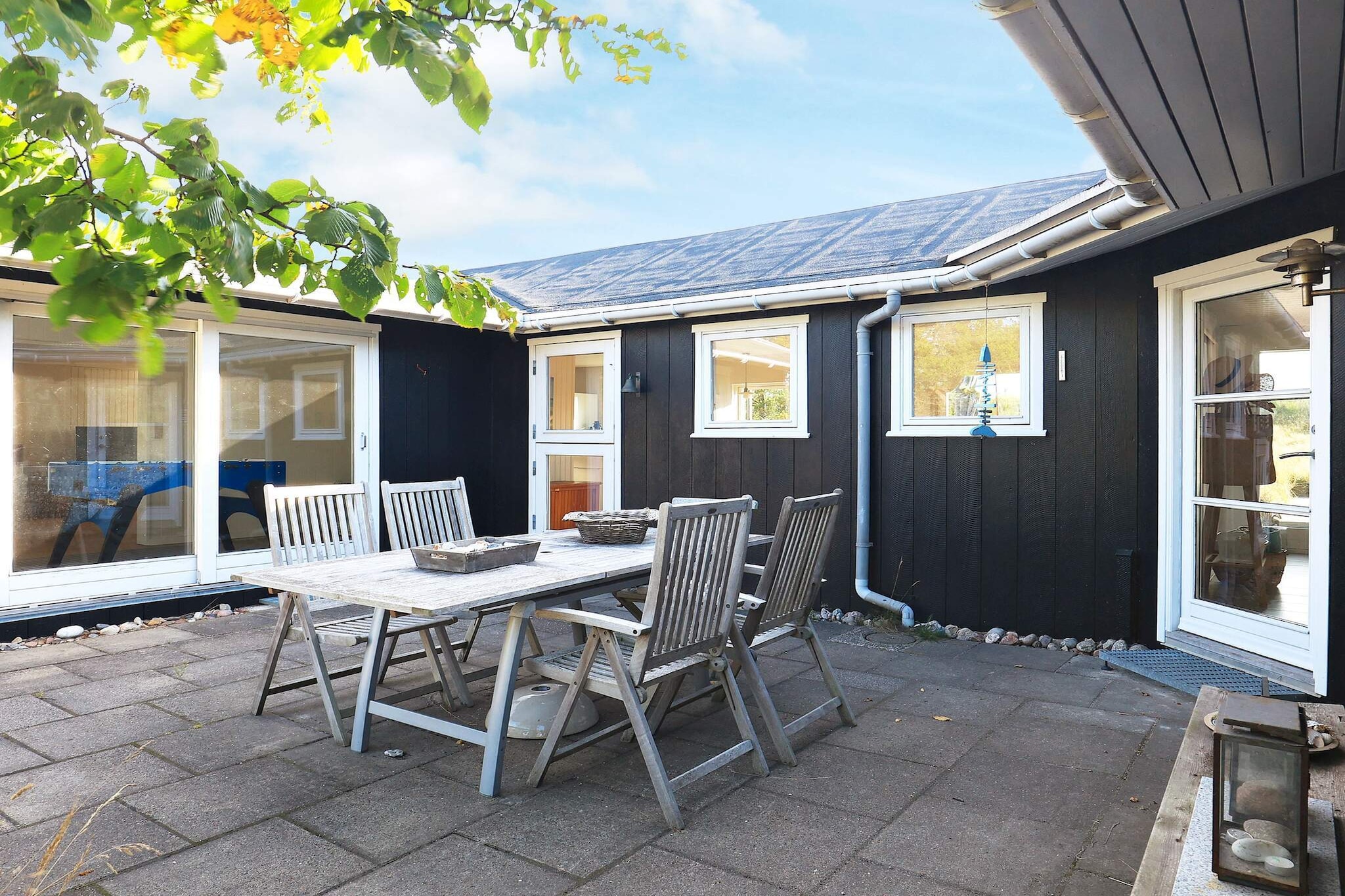 In the attractive nature and holiday area close to Ã…lbÃ¦k is this beautiful cottage, which has been renovated inside and out in 2018. The original decor / furnishings from 1954 have been partially preserved and give the house a tranquility, where time has stood still with lots of charm and soul. Together with new simple and modern decor / furnishings, the house is extremely attractive, comfortable and personal. The cottage is very bright with large windows and sliding doors to the dunes and the four terraces, which let the light in all year round, and you can step directly into nature. There are great views to the east and south. Summer invites to open the sliding doors towards the dunes, and winter invites to light a fire in the stoves and the many candles. The house is furnished with 2 departments and is perfect for 2 families or 1 family with 2 generations. Both departments have a wood burning stove and a view to / direct access to the dunes towards the beach and the four terraces. All with teak garden furniture, two removable parasols, baskets you can fill with beach shells and lanterns you can light in the evening. The large department has a large bright living room with wood stove, TV, sofa group and dining table as well as an adjoining activity room with table football, sofa / armchairs and access to the west-facing terrace with evening sun. A large bright kitchen family room with dining table and exit to the east facing terrace with morning & # 8211; and afternoon sun. Two good bedrooms, one of which has access to a south-facing terrace and access to the loft with sea view. There is a bathroom with a shower and a guest toilet. The small department has a bright living room with wood stove and small open kitchen as well as armchairs / sofa, which can be turned out to be a sofa bed. There is a bookcase with books, games and drawings. Direct access to two terraces to the south and east. Large bedroom with two single beds and a bathroom with washing machine. The house is located on a large natural plot / beach plot in the 1st dune row with its own path directly down to the child-friendly sandy beach, which invites for both morning & # 8211; and evening dip. There is a swing state

A refundable deposit might be charged closer to your check-in date. This deposit covers utilities consumed during your stay and any additional services that may be taken. The final amount will be adjusted based on actual meter readings, actual usage of extra services, and any remaining balance will be refunded within 21 days after checkout.