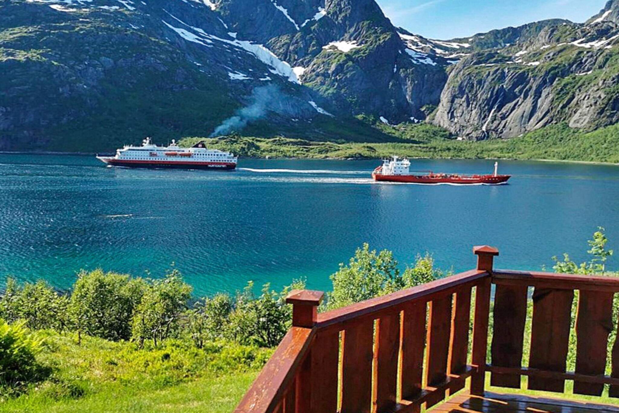 A great holiday cottage with a wonderful location in Lofoten. Panoramic view of the sea and mountains. Enjoy the bath barrel. The cottage has a charming interior. In the living room there is a wood-burning stove with a glass door. Satellite dish with many international channels. There is a gas grill on the terrace. The cottage is located on a sunny plot below the mountains by the village of Raften. The grandeur view from the cottage and terrace is a great experience. From the terrace you can watch as boats pass by. The mountains on the other side of the straight are an impressive sight. Watch the sunset in the west on bright summer and spring nights. On cold days, go for a warm bath in the bath barrel. Be aware of the steep road up to the cabin! During periods of rainfall or snow with limited access for cars, the car can be parked on the access road down by the main road 100m. Go for lovely walks in the mountains around the cottage. 100 metres to the sea where you find the fishing conditions to be excellent. You can rent a motorboat in Digermulen (10km), where you also find shops and restaurant. One double bed is 120 cm wide. Another bed is a bunk bed with a 120 cm wide double bed below and single bed above. Access the third bedroom via the terrace by the entrance. Possible to go fishing by boat with local skipper.