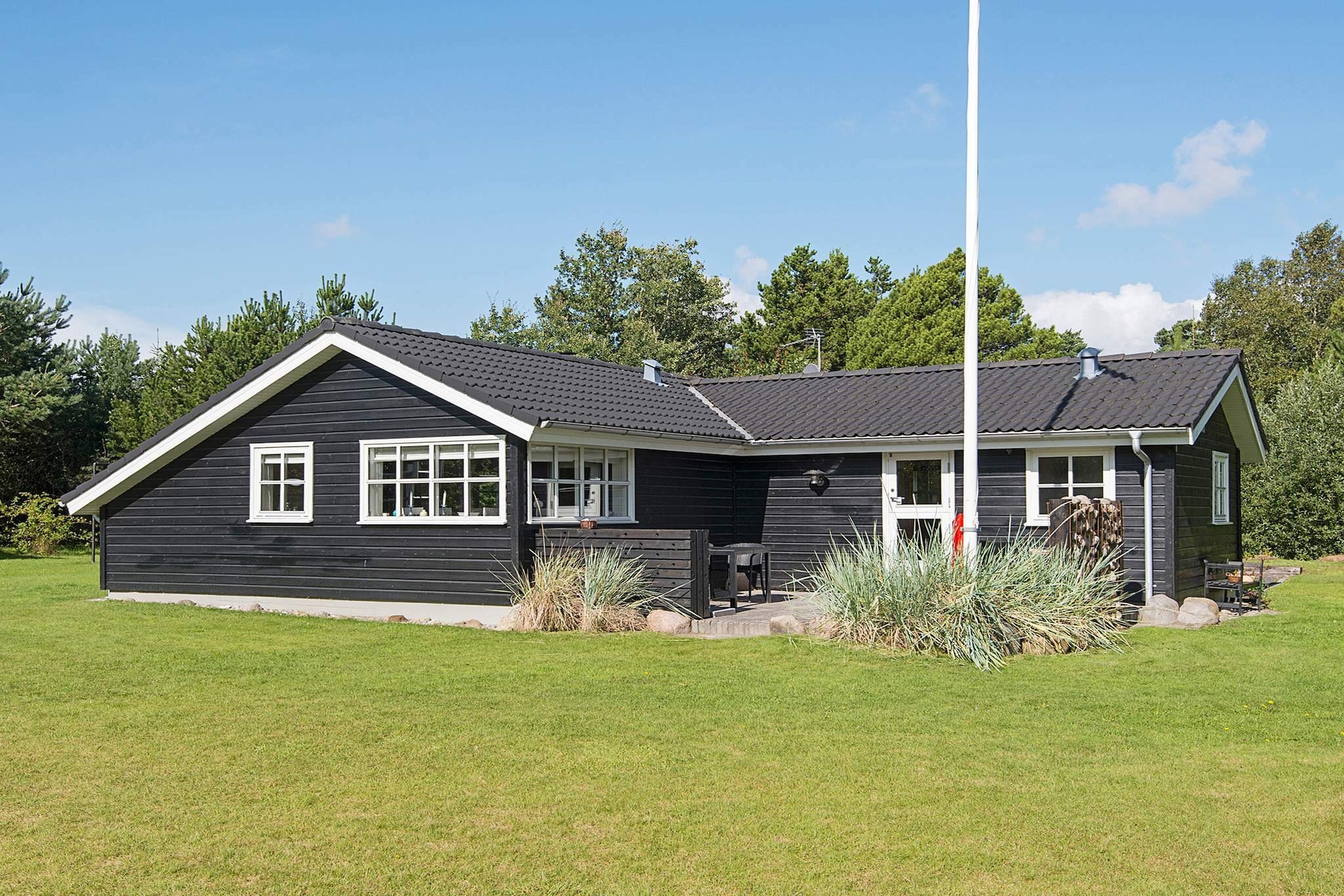 Well-kept cottage with a beautiful location only approx. 100 m from the child-friendly beach, grocery store and playground. The cottage is furnished with 3 good rooms, bathroom with underfloor heating and open kitchen to the living room with ceiling to kip and wood stove. There is access to the terrace from the living room, where you can enjoy the sun and relax in the garden furniture. There is a playground with 2 play towers, several different play equipment and a large sandpit as well as swings, football goals and a fire pit, where the whole family can have fun together.
A refundable deposit might be charged closer to your check-in date. This deposit covers utilities consumed during your stay and any additional services that may be taken. The final amount will be adjusted based on actual meter readings, actual usage of extra services, and any remaining balance will be refunded within 21 days after checkout.