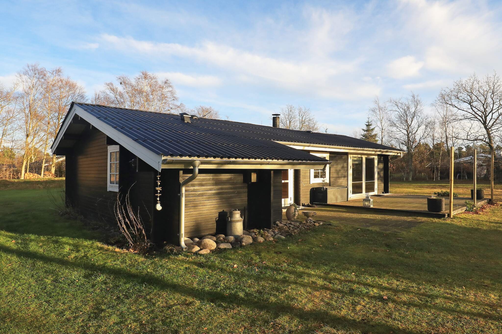 Internet Access DSL, open kitchen(cooker(electric), hood, coffee machine, dishwasher, fridge(+ freezer), washing machine), Living/bed room(TV, radio), bedroom(double bed), bedroom(2x single bed), bathroom(floor heating)(bathtub or shower, washbasin, toilet), carport, heating(electric), terrace, BBQ, air to air heatpump