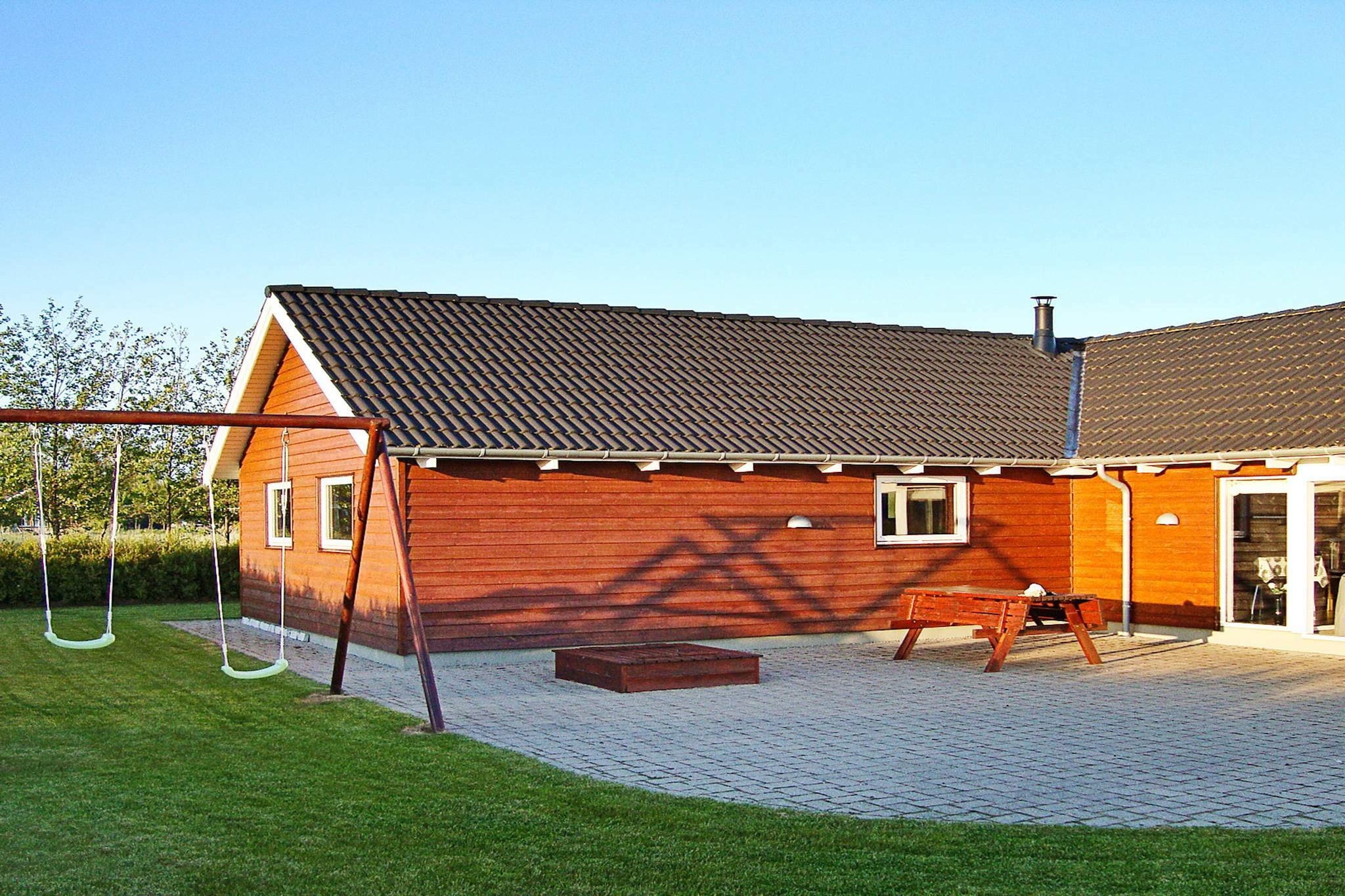 Holiday cottage with whirlpool and sauna and a 25 m² large activity room where you can get a good game of billiards and then a game of table tennis or table football and a game of darts. There is a changing table, baby bath, cot and high chair, and outdoors there are swings. 2 bathrooms, one with whirlpool and sauna. There are heated floors in the bathrooms. The crackling fire from the wood-burning stove can be enjoyed indoors.  There is Smart-Tv. The kitchen is well-equipped with everything contemporary style requires. Extra fridge available. The garden is landscaped with lawn and tiles from the driveway and around the house. There is a carport and good driveway and parking lot. There are 100 m² open terrace and 20 m² covered. No letting to youth groups.A refundable deposit might be charged closer to your check-in date. The security deposit ensures a smooth stay and covers any additional services or consumption charges.This deposit covers utilities consumed during your stay and any additional services that may be taken.The final amount will be adjusted based on actual meter readings, actual usage of extra services, and any remaining balance will be refunded within 21 days after checkout.This deposit simply acts as a prepayment for charges that  you would anyways pay for, ensuring a seamless stay and check-out experience.