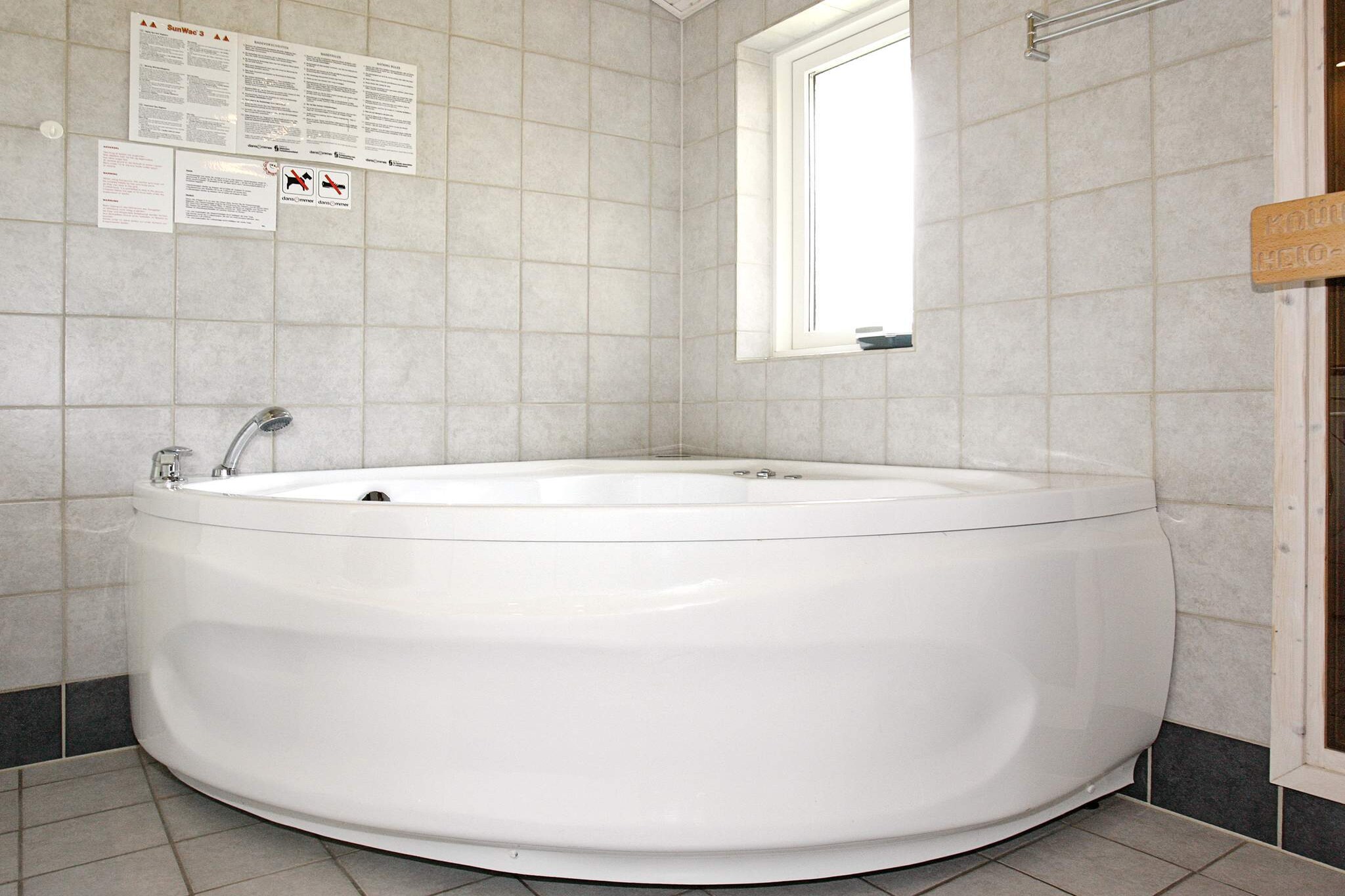 open kitchen(cooker(electric), hood, coffee machine, microwave, dishwasher, fridge-freezer), Living/bed room(TV(satellite), radio, stereo unit, high chair), bedroom(double bed, children\'s bed), bedroom(double bed), bedroom(2x single bed), bathroom(floor heating)(tumble dryer, bathtub or shower, washbasin, toilet, washing machine), Bubble bath(indoor, heated, 2 persons), sauna(indoor, heated, 2 persons), heating(electric), terrace, terrace(roofed), air to air heatpump