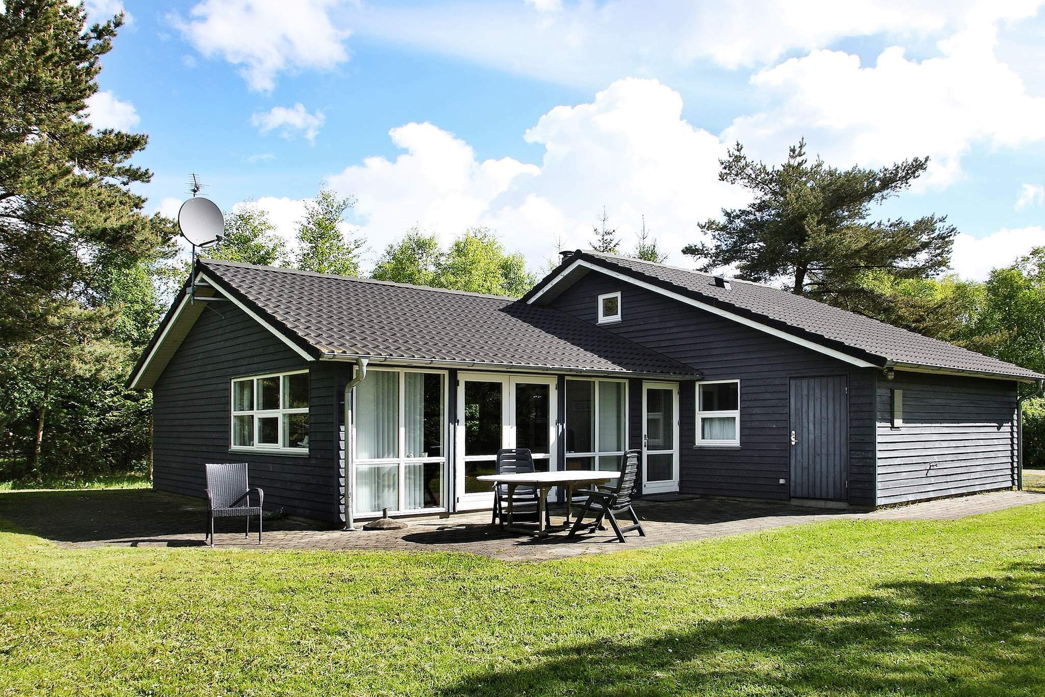 In the scenic Råbjerg approx. 200 m from the popular gold course Hvide Klit is this his holiday cottage on a natural plot. There are 2 terraces facing south and west. Adjacent to the split-level living and dining room is the kitchen area. There are good bedrooms and 2 bathrooms, both with underfloor heating, and one also has whirlpool for relaxation after a long day. There is a wood-burning stove with firewood free of charge.A refundable deposit might be charged closer to your check-in date. The security deposit ensures a smooth stay and covers any additional services or consumption charges.This deposit covers utilities consumed during your stay and any additional services that may be taken.The final amount will be adjusted based on actual meter readings, actual usage of extra services, and any remaining balance will be refunded within 21 days after checkout.This deposit simply acts as a prepayment for charges that  you would anyways pay for, ensuring a seamless stay and check-out experience.
