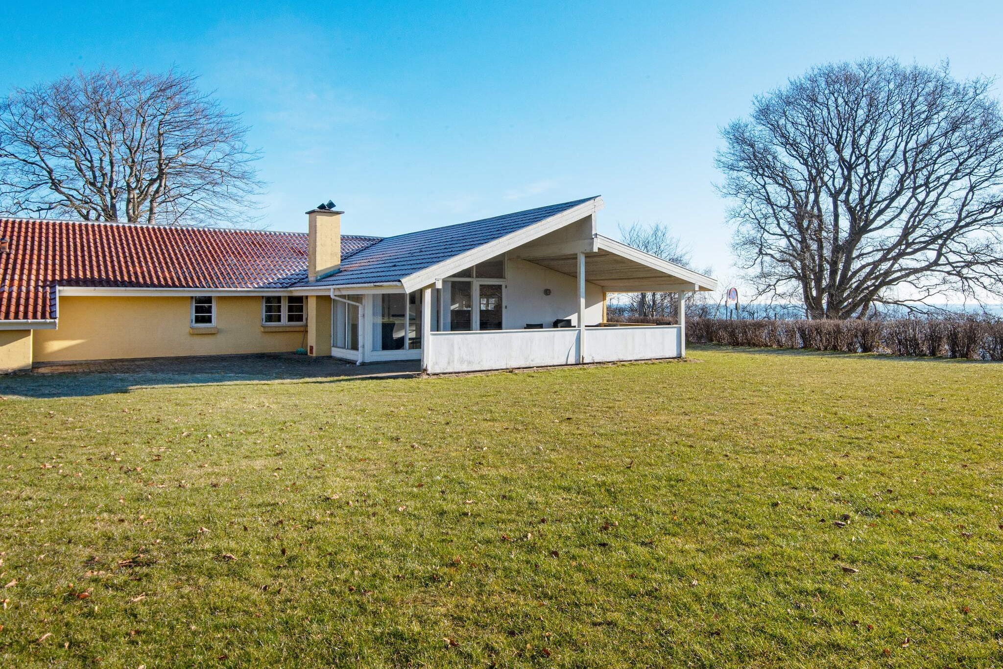 A unique holiday cottage with a whirlpool that fits 6 people and a sauna. The interior is bright and modern and nicely furnished. The house is located on a plot close to the water. You can enjoy the view of Vejle Fjord from the living room, kitchen and terrace.A refundable deposit might be charged closer to your check-in date. The security deposit ensures a smooth stay and covers any additional services or consumption charges.This deposit covers utilities consumed during your stay and any additional services that may be taken.The final amount will be adjusted based on actual meter readings, actual usage of extra services, and any remaining balance will be refunded within 21 days after checkout.This deposit simply acts as a prepayment for charges that  you would anyways pay for, ensuring a seamless stay and check-out experience.