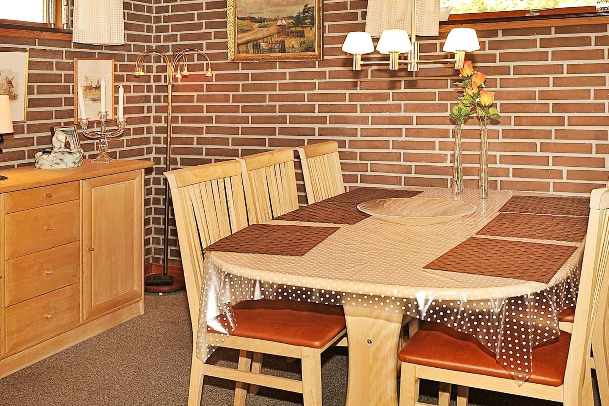 open kitchen(cooker(electric), coffee machine, dishwasher, fridge-freezer), Living/bed room(TV(cable, german television channels, danish TV channels (DR1 and TV2)), DVD player, radio, CD player, stereo unit), bedroom(double bed), bedroom(2x bunk bed), bathroom(bathtub or shower, washbasin, toilet), carport, heating(electric), terrace, BBQ, air to air heatpump